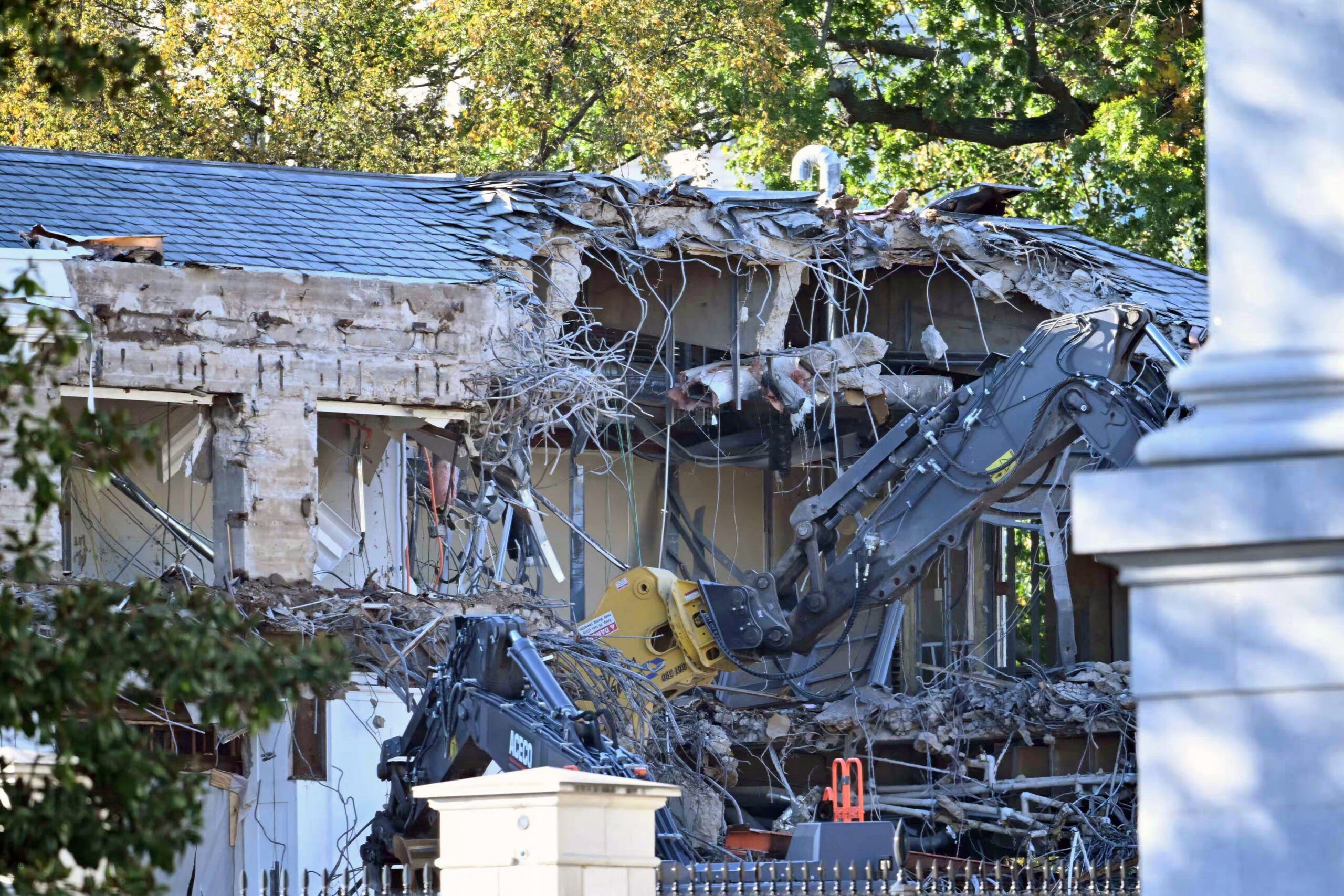 Heavy machinery tears down a section of the East Wing of the White House