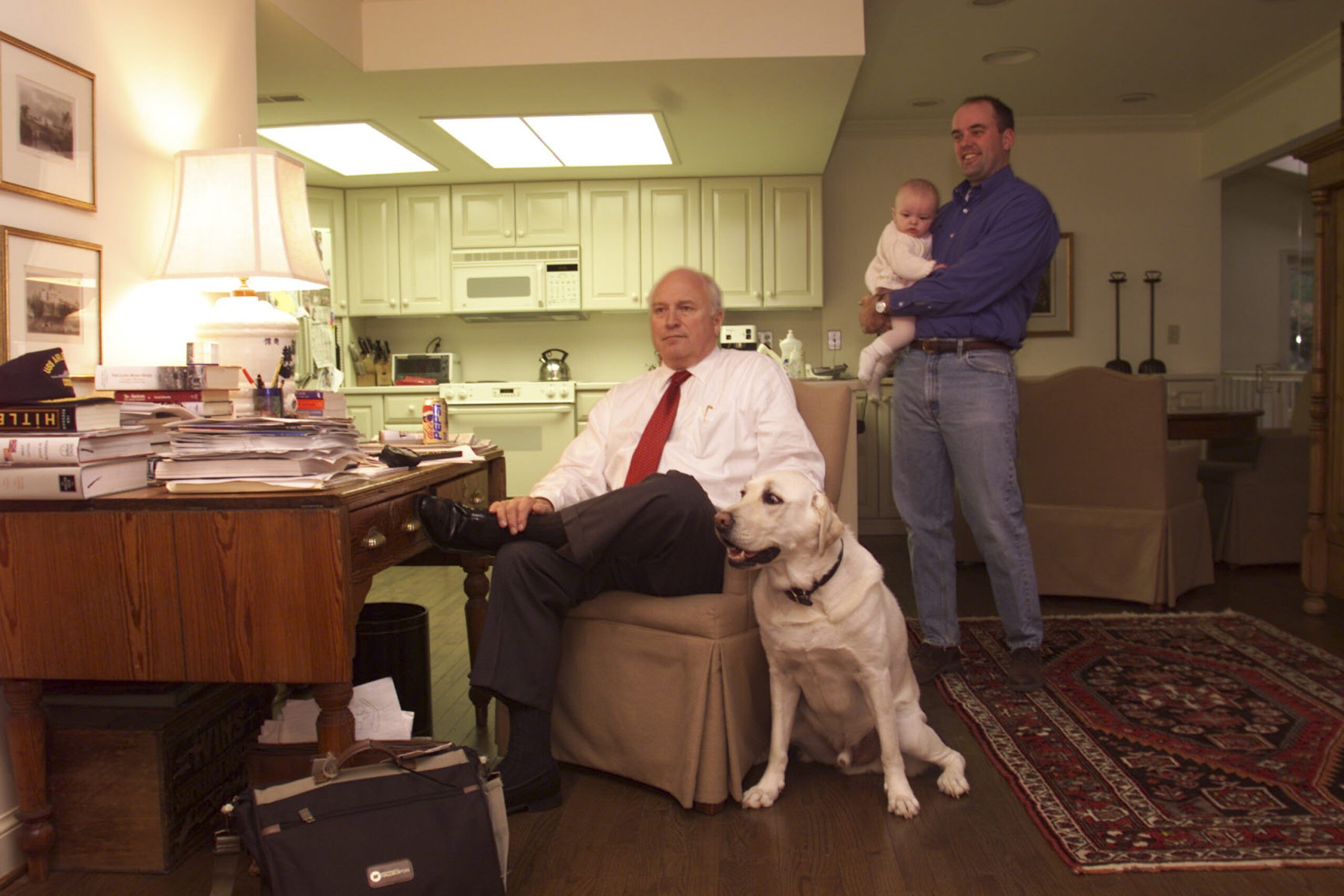 Dick Cheney at home in McLean, Virginia with his dog and son-in-law who is holding a baby