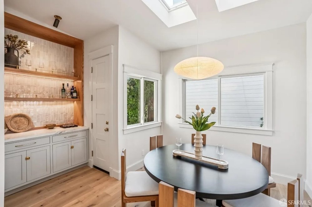 Bright Compact Dining Room with Skylight