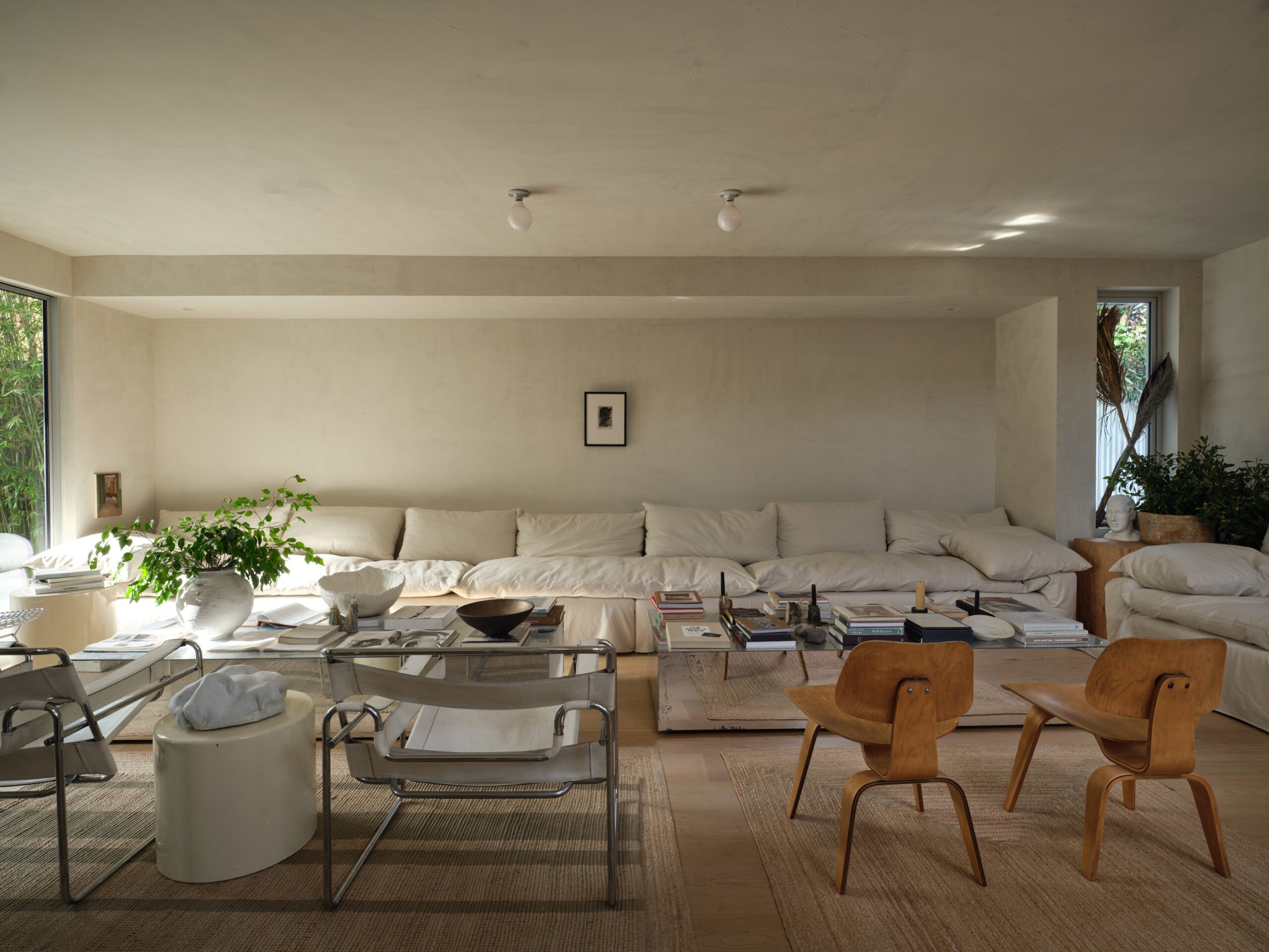 Living space with large white couch in HGTV Star Leanne Ford and Buck Mason Erik Ford Venice home