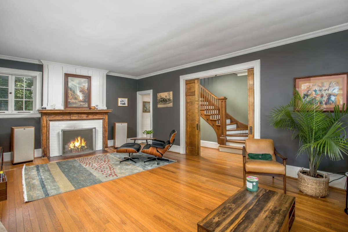 living room with lots of wood tones and a fireplace