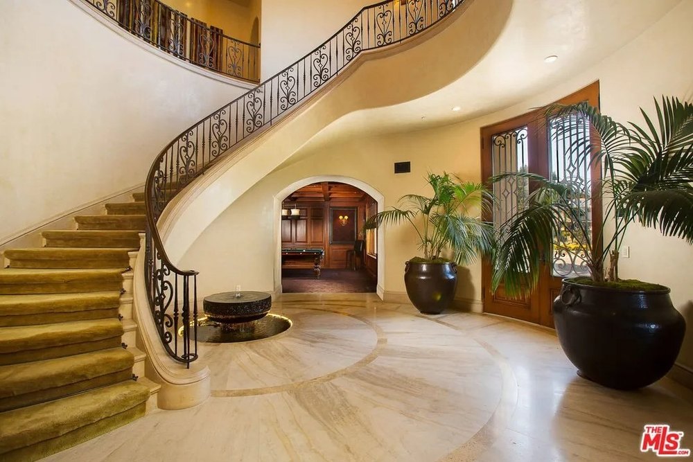 Grand staircase in a home on the land where sharon tate was murdered