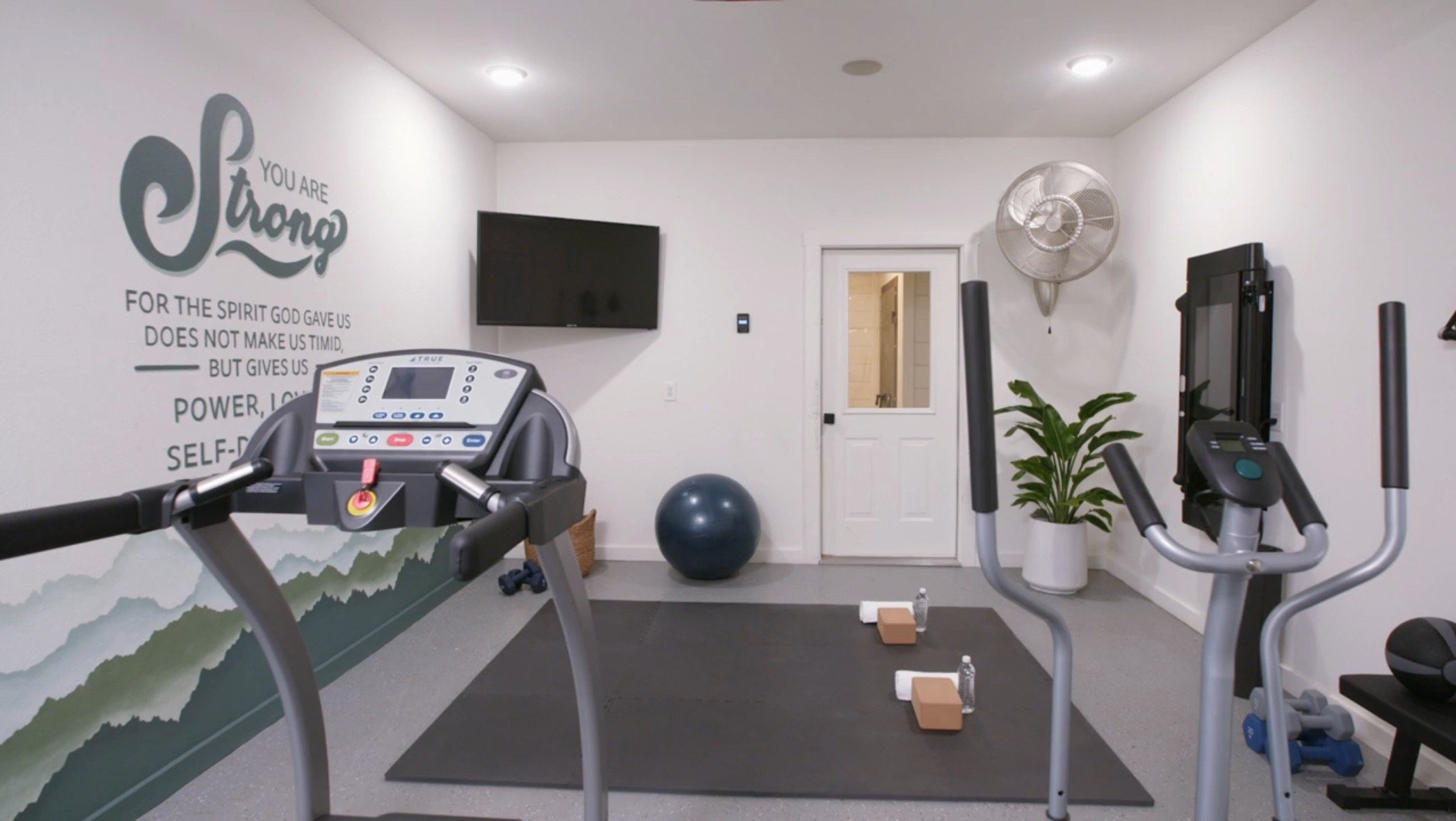 The Marrses made a gym out of an extra garage bay.