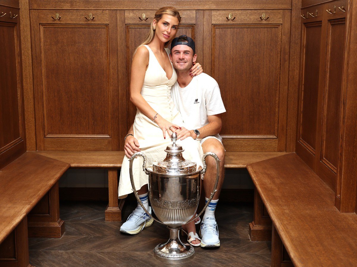 Tommy Paul and Paige Lorenze pose together after his big win