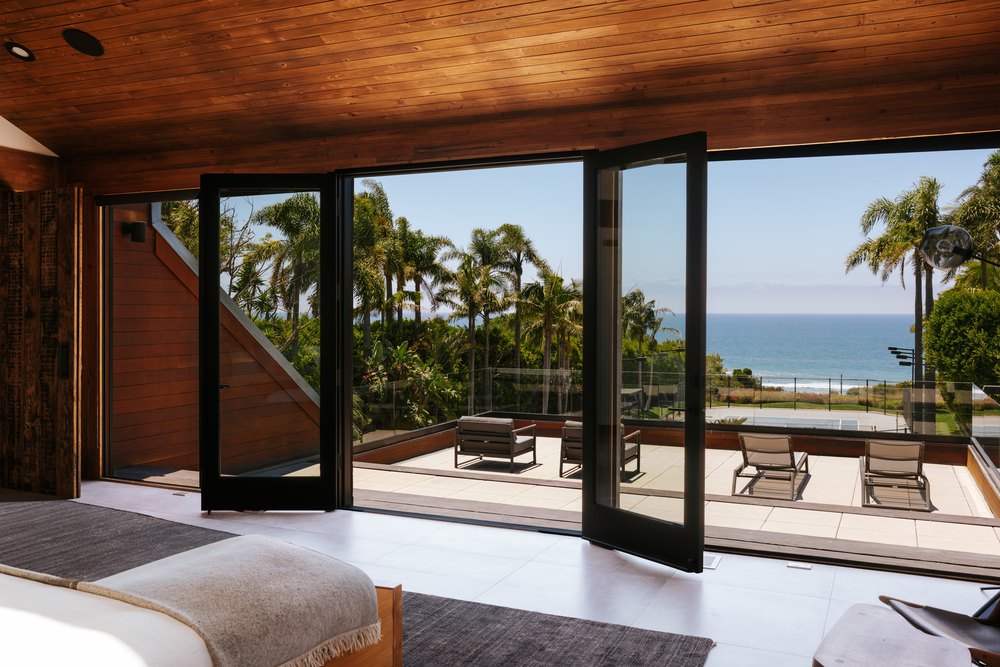Doors to a balcony at a home in Malibu belonging to Sean William Scott