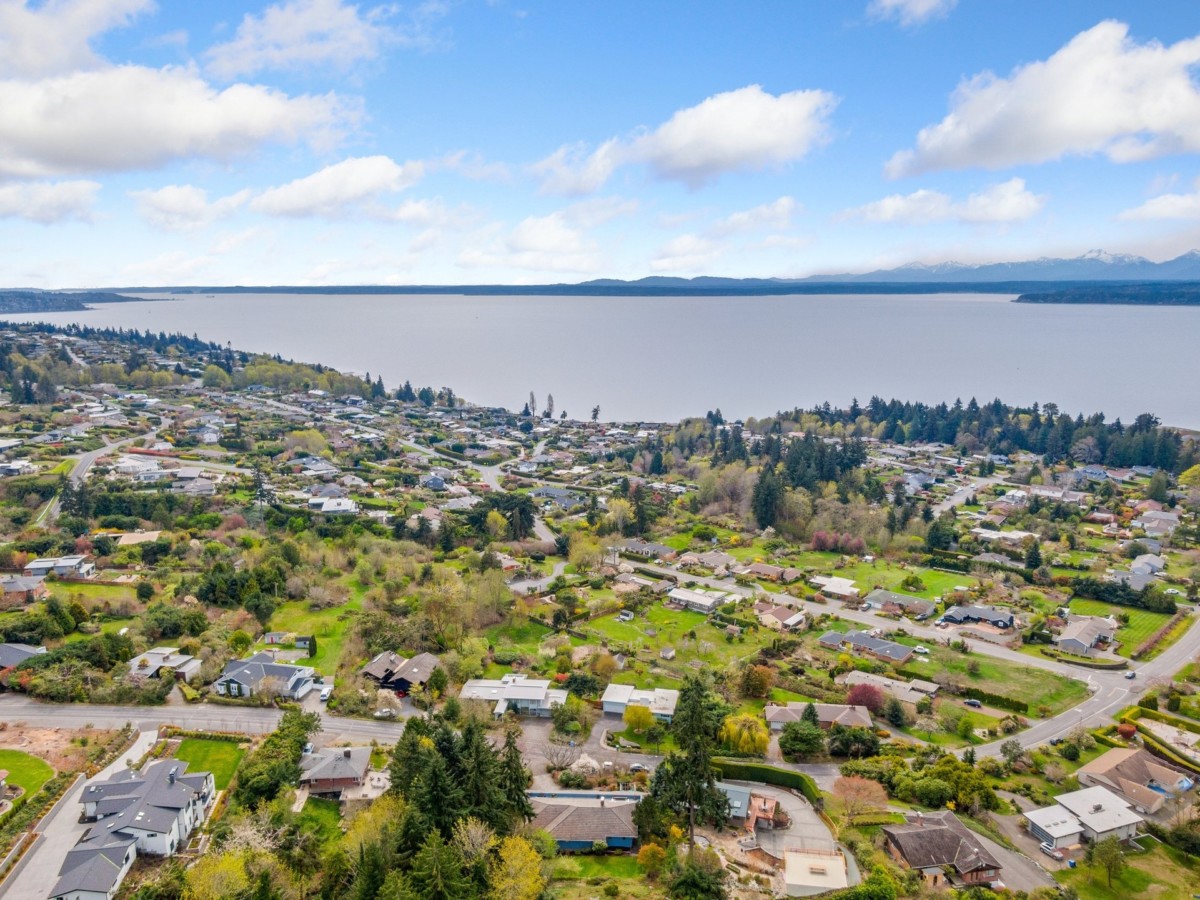 aerial view of homes next to the water