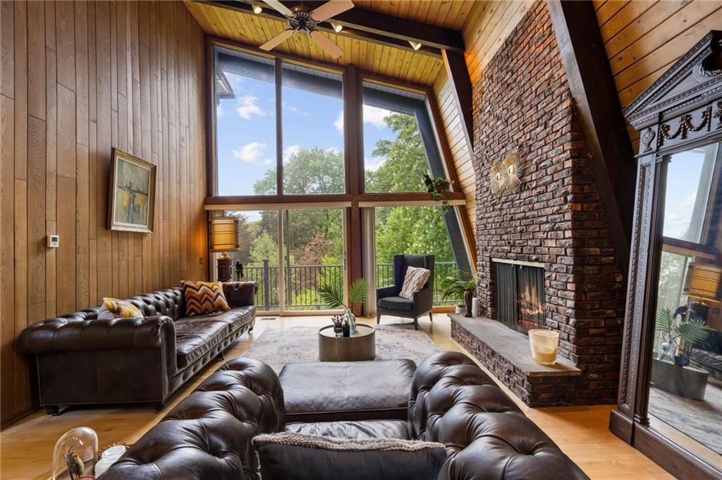 living room with a fireplace that prevents heat loss in a home