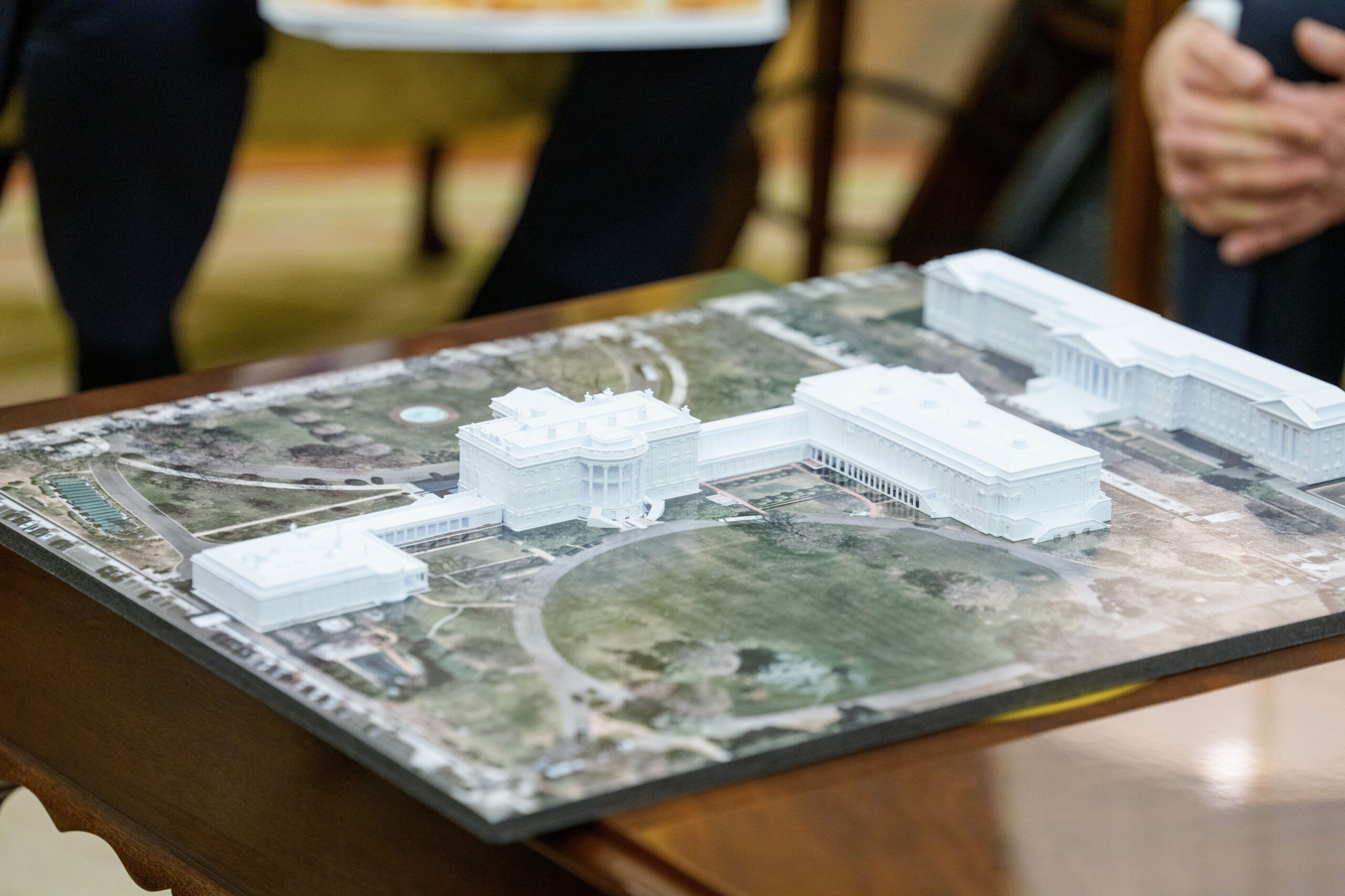 A model of the White House with the planned ballroom extension during a meeting between US President Donald Trump and Mark Rutte, secretary general of the North Atlantic Treaty Organization (NATO), not pictured, in the Oval Office of the White House in Washington, DC, US, on Wednesday, Oct. 22, 2025. Trump said he planned to speak to Xi Jinping about China's purchases of Russian oil when the two leaders meet next week in South Korea, after the US president on Wednesday announced fresh sanctions on top energy companies with ties to the Kremlin. Photographer: Aaron Schwartz/CNP/Bloomberg via Getty Images