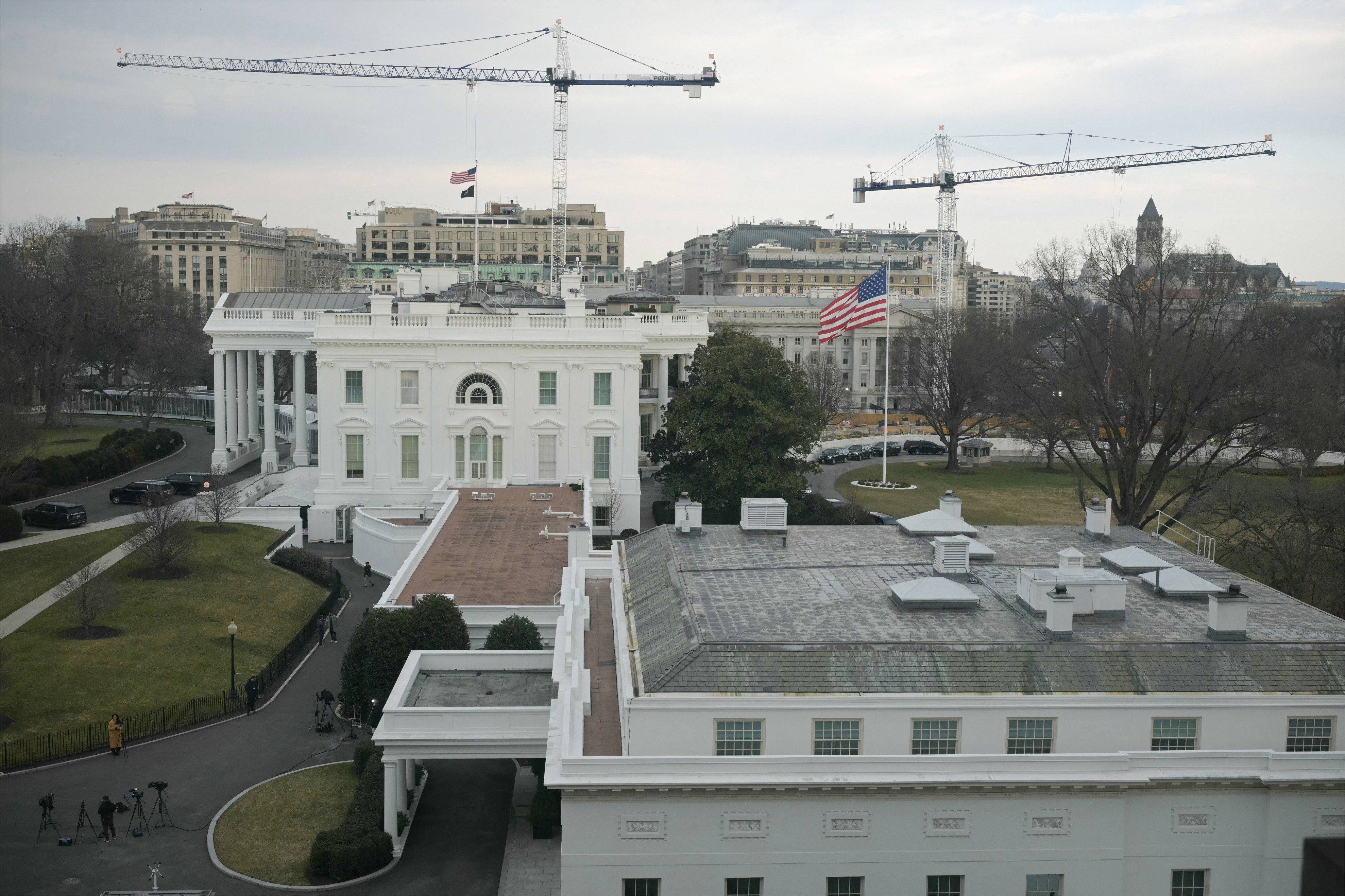 Cranes are seen on the grounds of the White House as construction work continues for US President Donald Trump's new ballroom in Washington