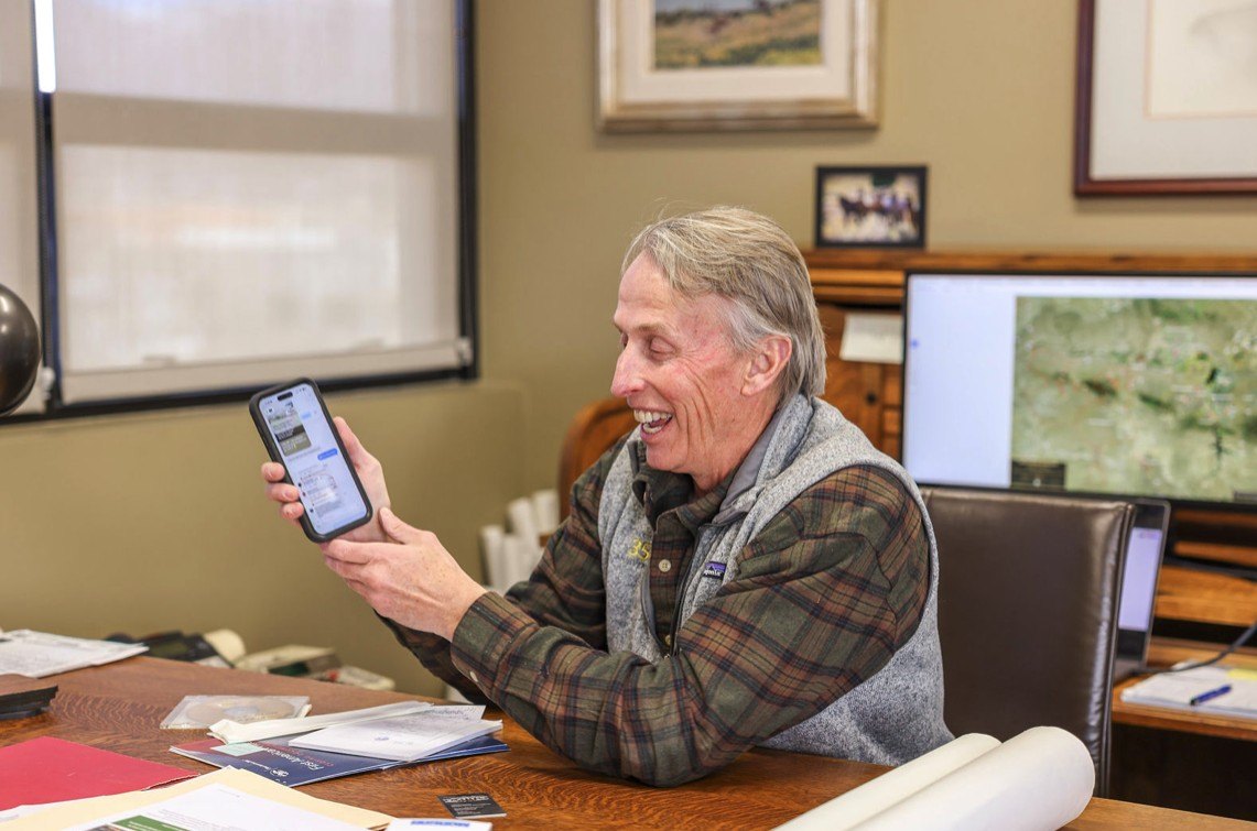 CEO Chris is highly amused by the comments on the articles about the news of the company's gigantic land purchase.