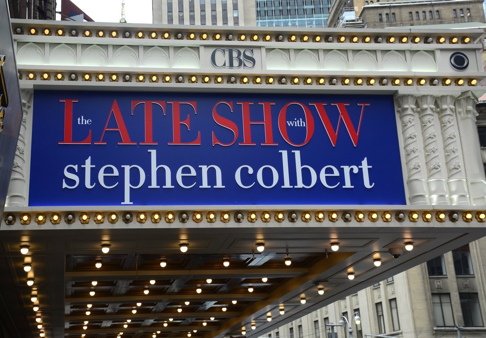 NEW YORK, NY - September 6, 2016:  Audience members line up at the Ed Sullivan Theater before entering to see the taping of The Late Show with Stephen Colbert television show. The historic theater on Broadway in New York City's Theater District has been a venue for live and taped radio and television shows since 1936. The theater is owned by the CBS Corporation. (Photo by Robert Alexander/Getty Images)