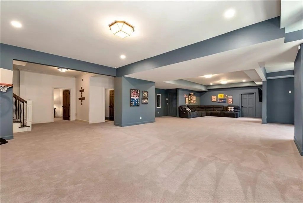 Large living space with blue walls in Kirk Cousins home in Georgia