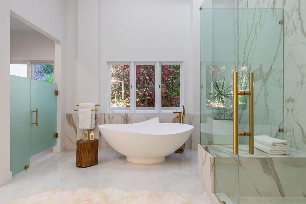Bathroom with a large tub in the Designer of Kate Hudson's 'How to Lose a Guy in 10 Days' Yellow Dress Home