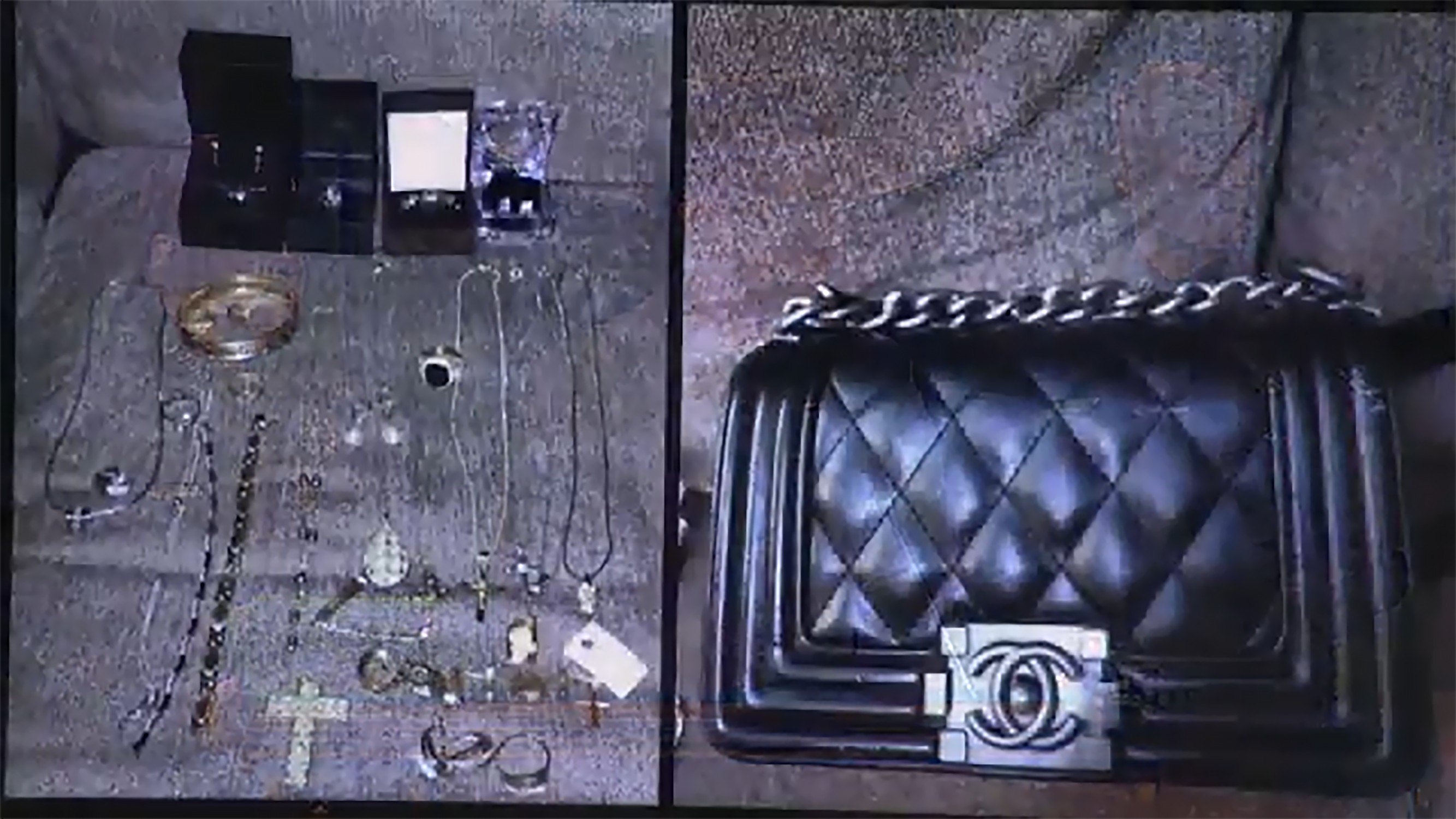 Stolen luxury items recovered by police, featuring fine jewelry displayed next to a black quilted Chanel handbag.