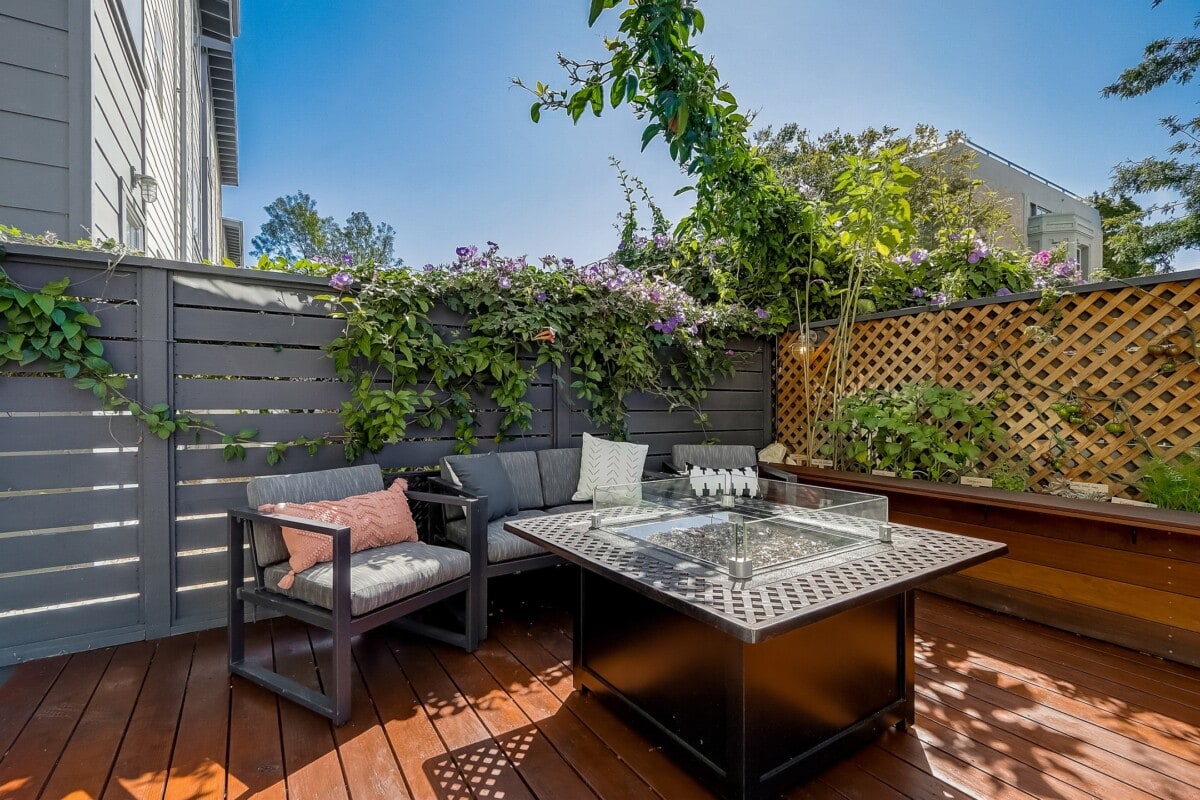 remodeled back porch with seating and firepit