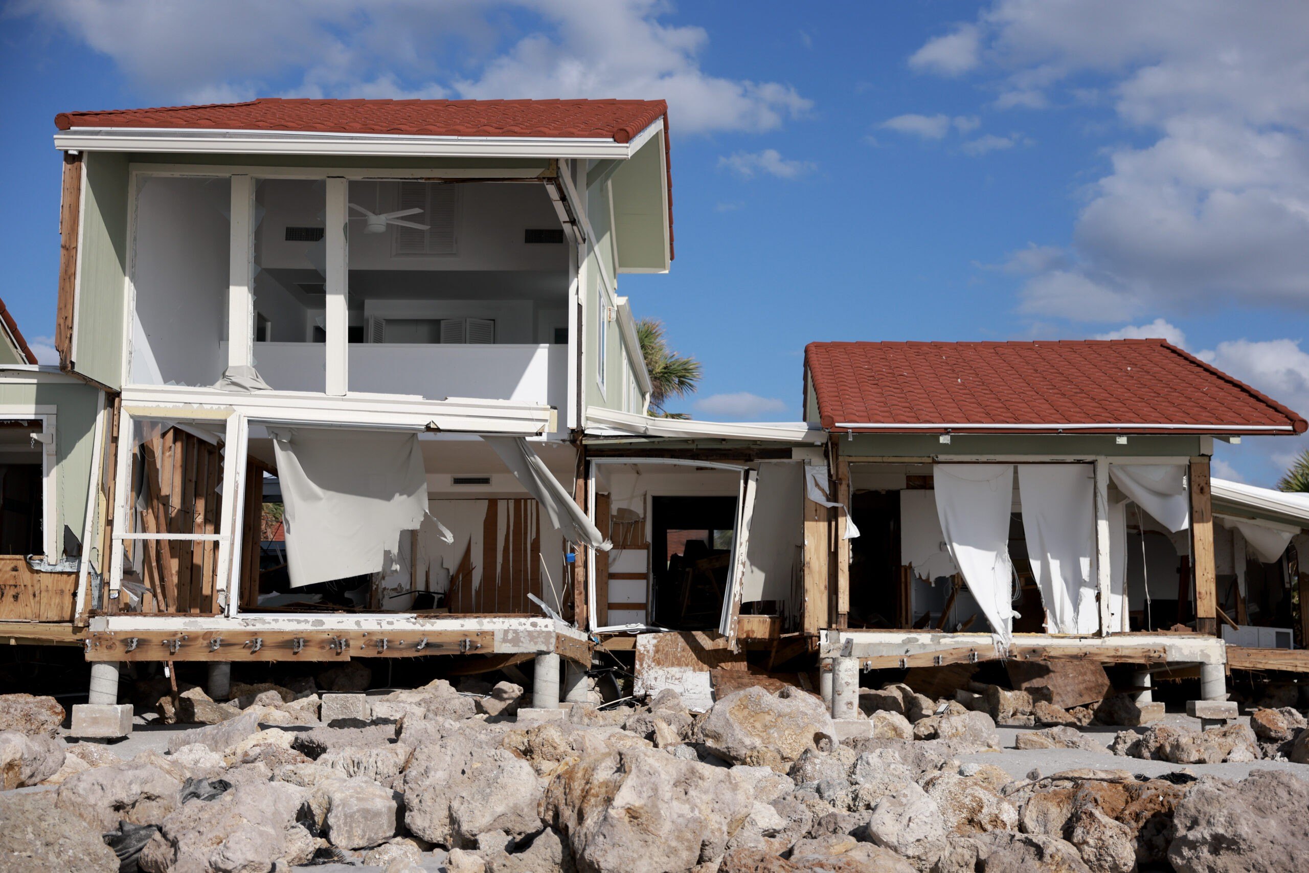The interior seen from the outside of a home that was damaged by Hurricane Milton