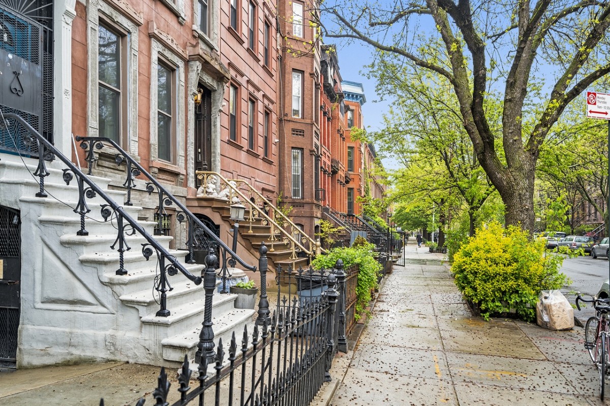exterior of a brownstone where railroad apartments are most likely located