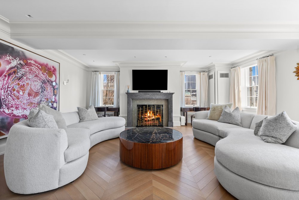 Living room with a fireplace in an 1800s home in Beacon Hill