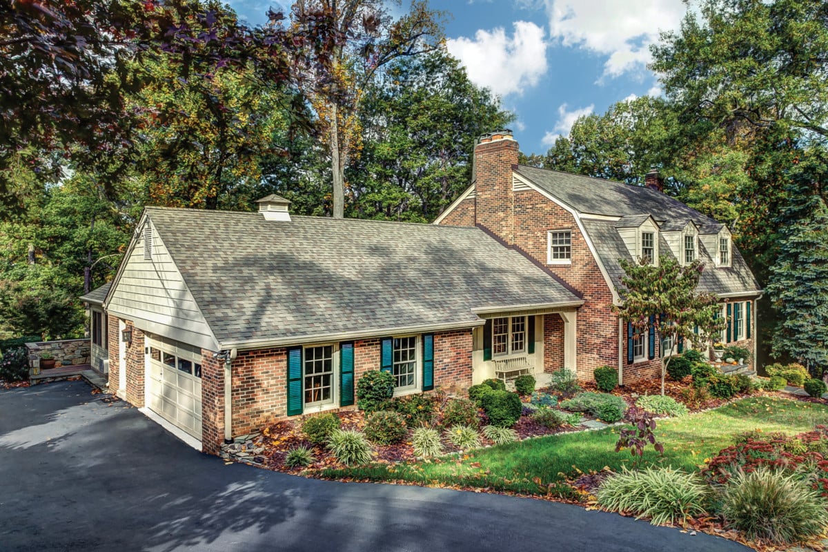 A brick home in the fall season