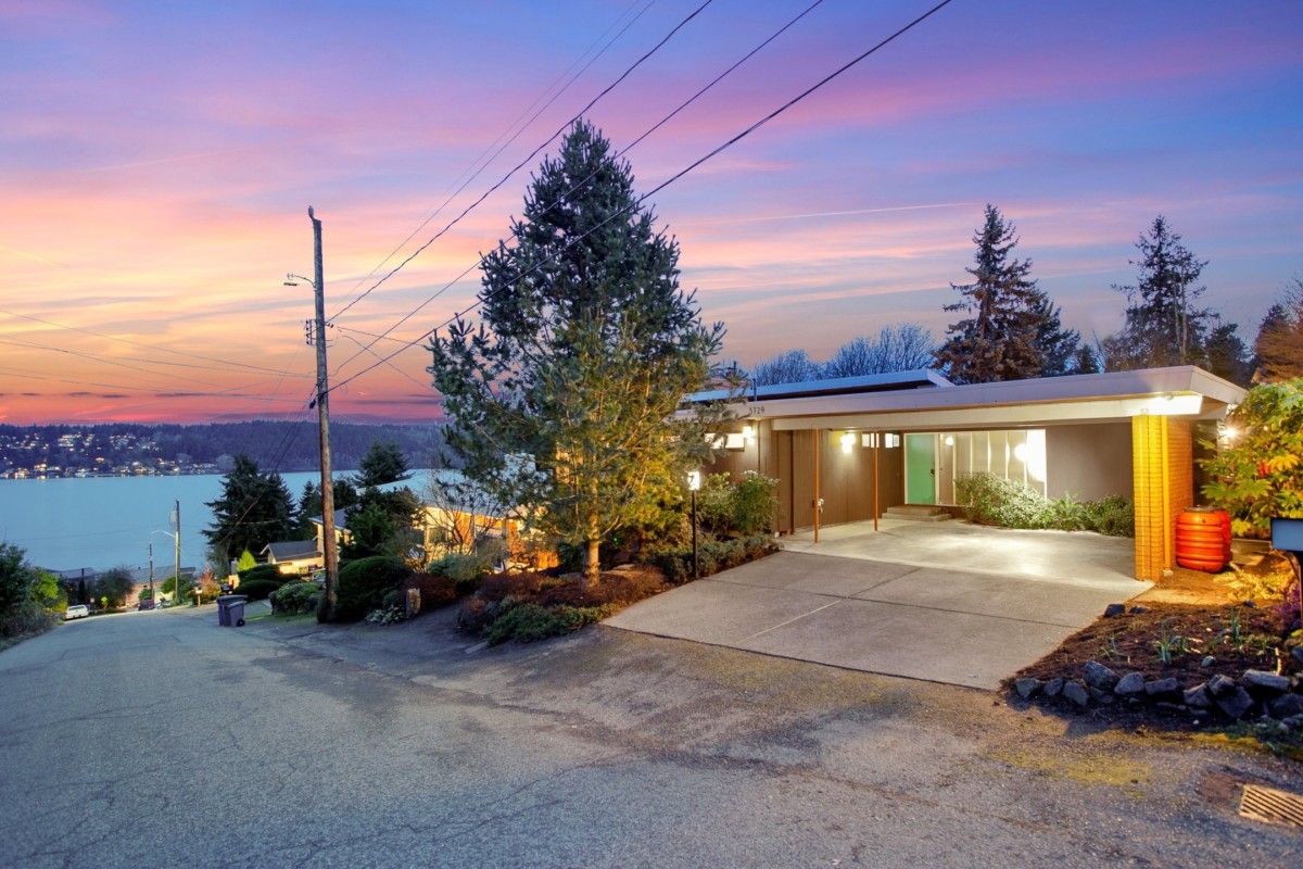 home with carport and sunset 