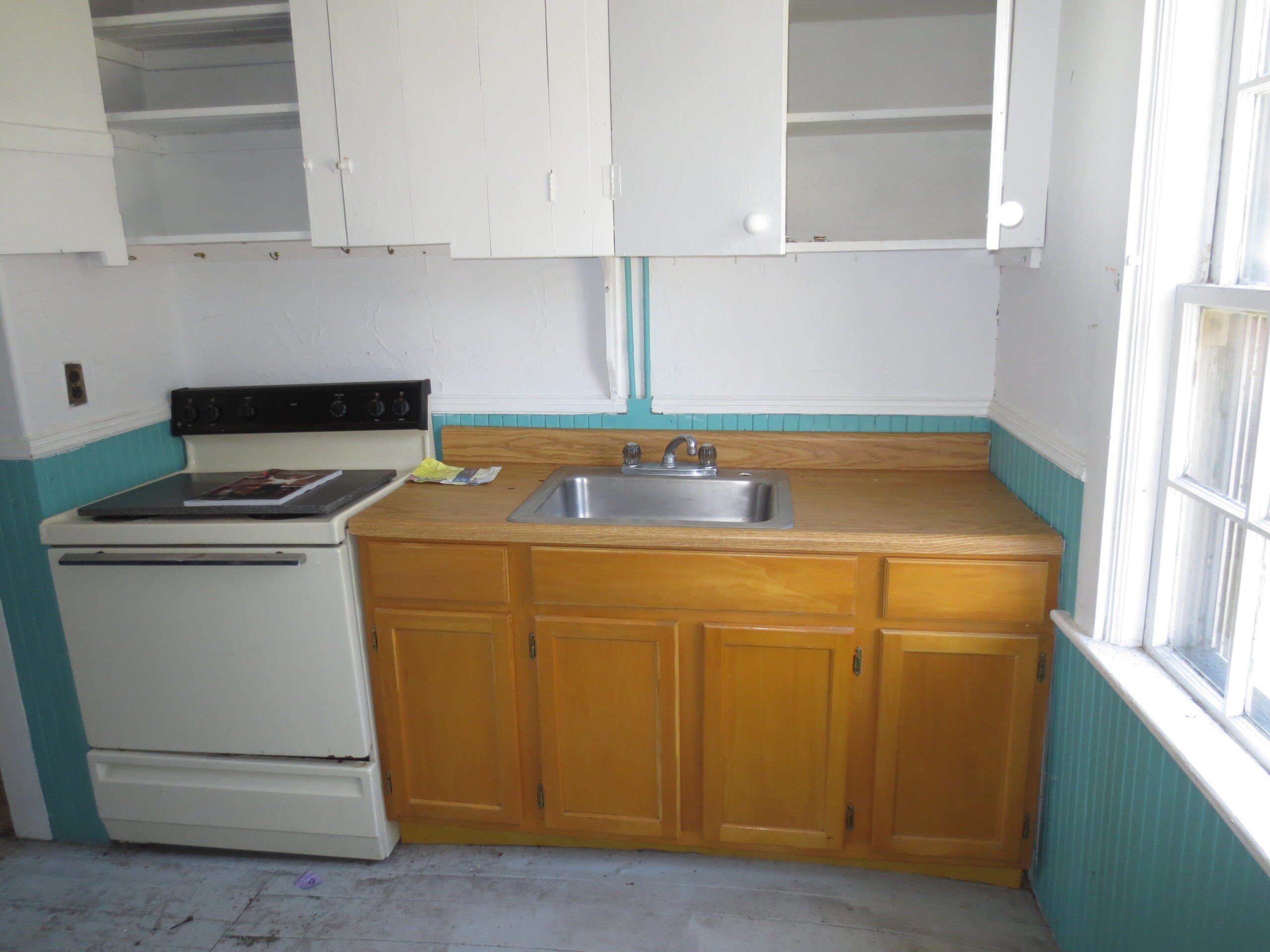 There wasn't anything left in the small unit kitchen worth salvaging.