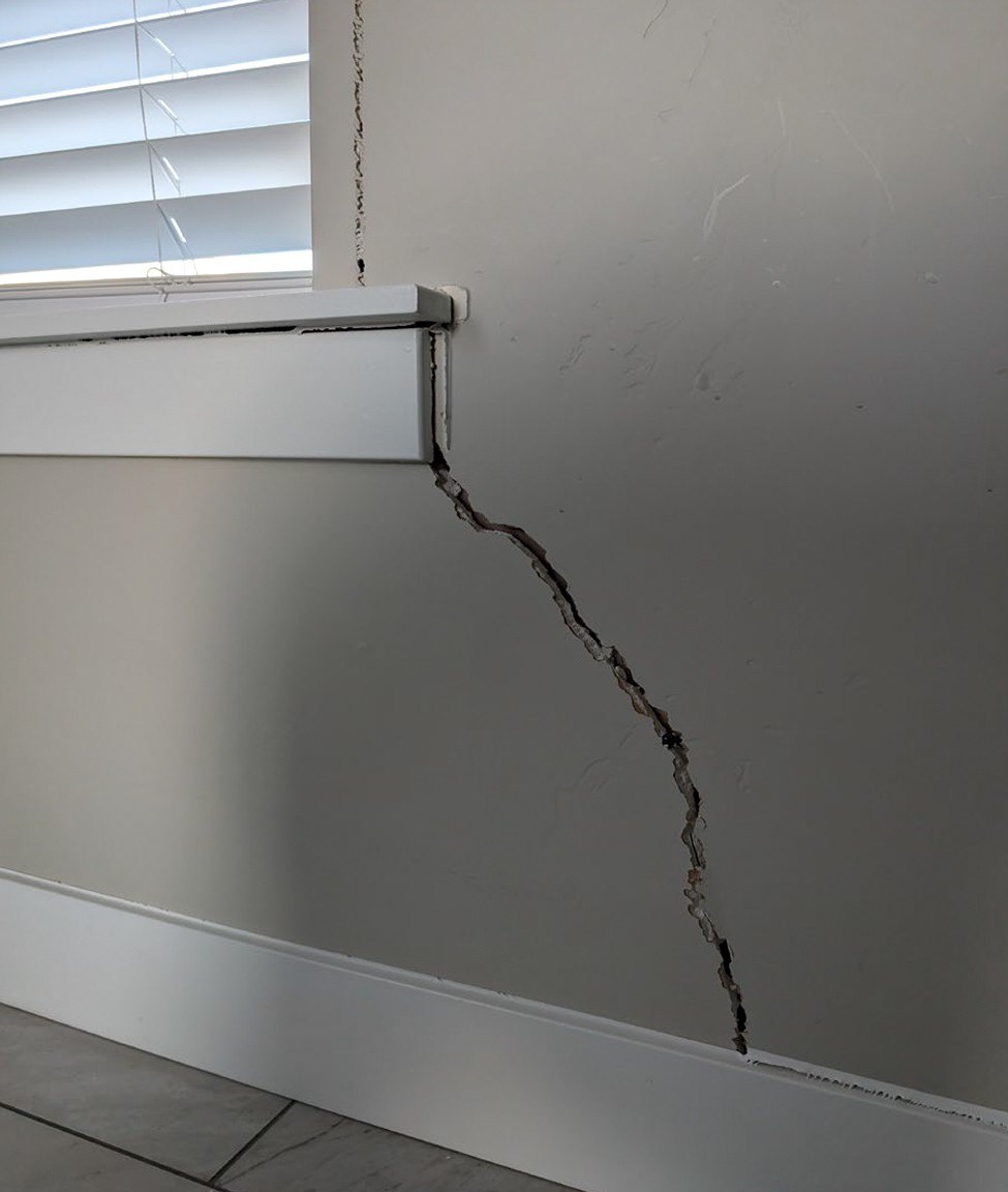 A crack in a wall in a home in Utah that is sinking