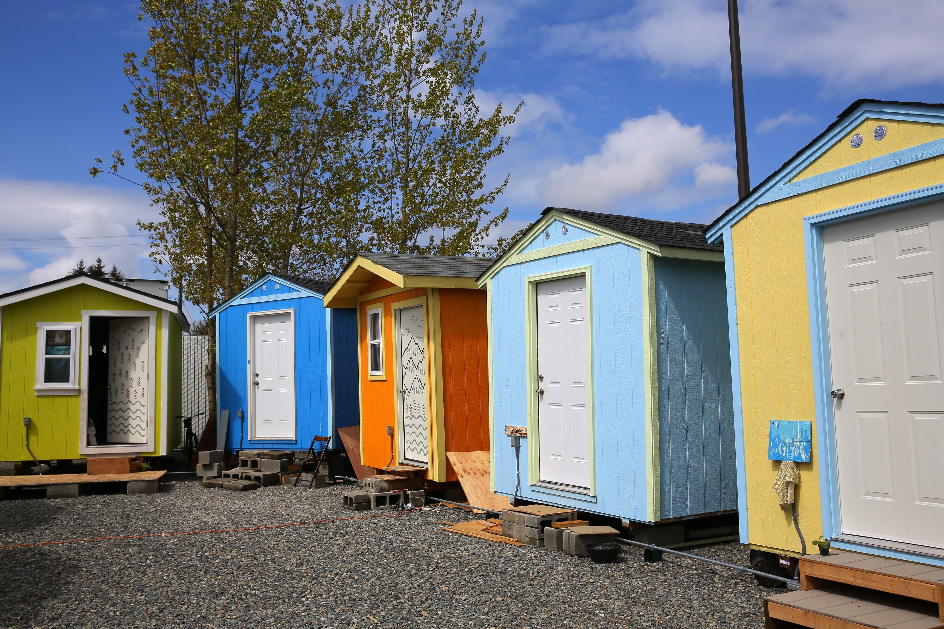 Colorful tiny houses are lined up inside the Georgetown tiny house village
