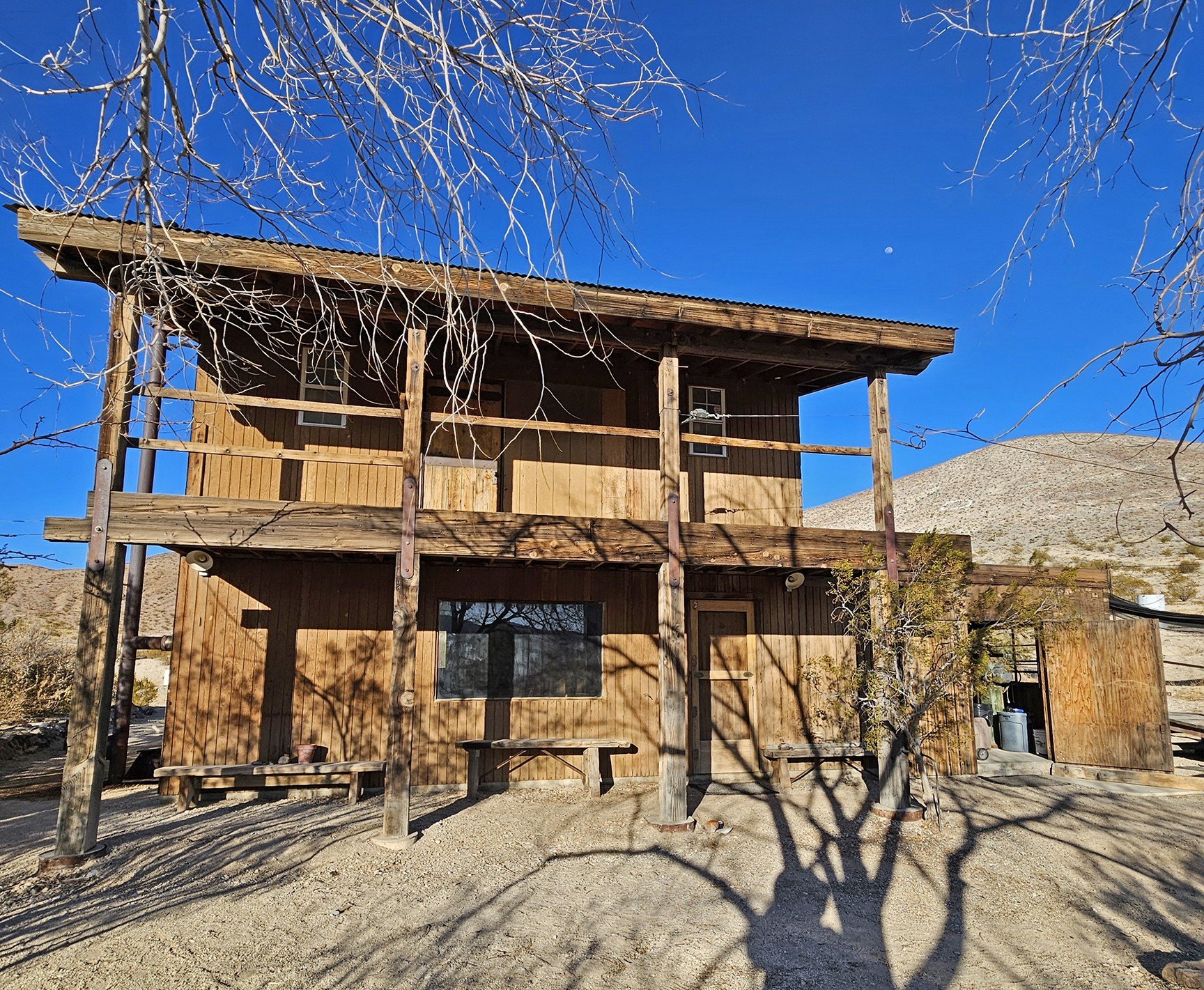 A view of a rundown home in the desert town of Darwin, CA
