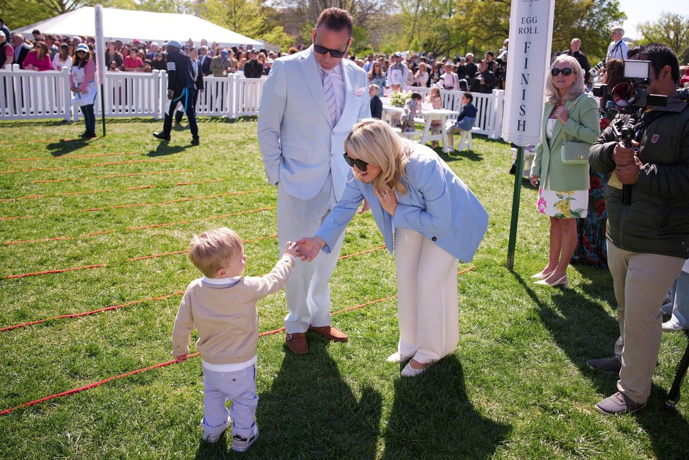 White House Press Secretary Karoline Leavitt (R) with her spouse Nicholas Riccio and son Nicholas "Niko" Robert Riccio attend the White House Easter Egg Roll on the South Lawn of the White House on April 06, 2026 in Washington, DC