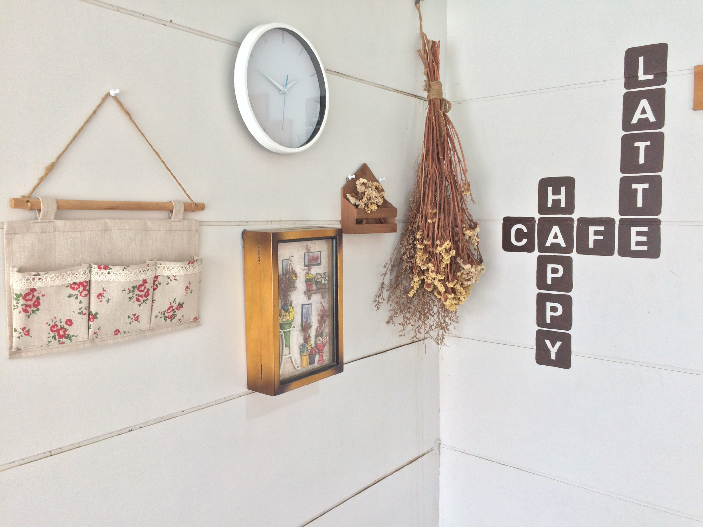 Removable wall decals placed decoratively in the corner of an apartment kitchen 