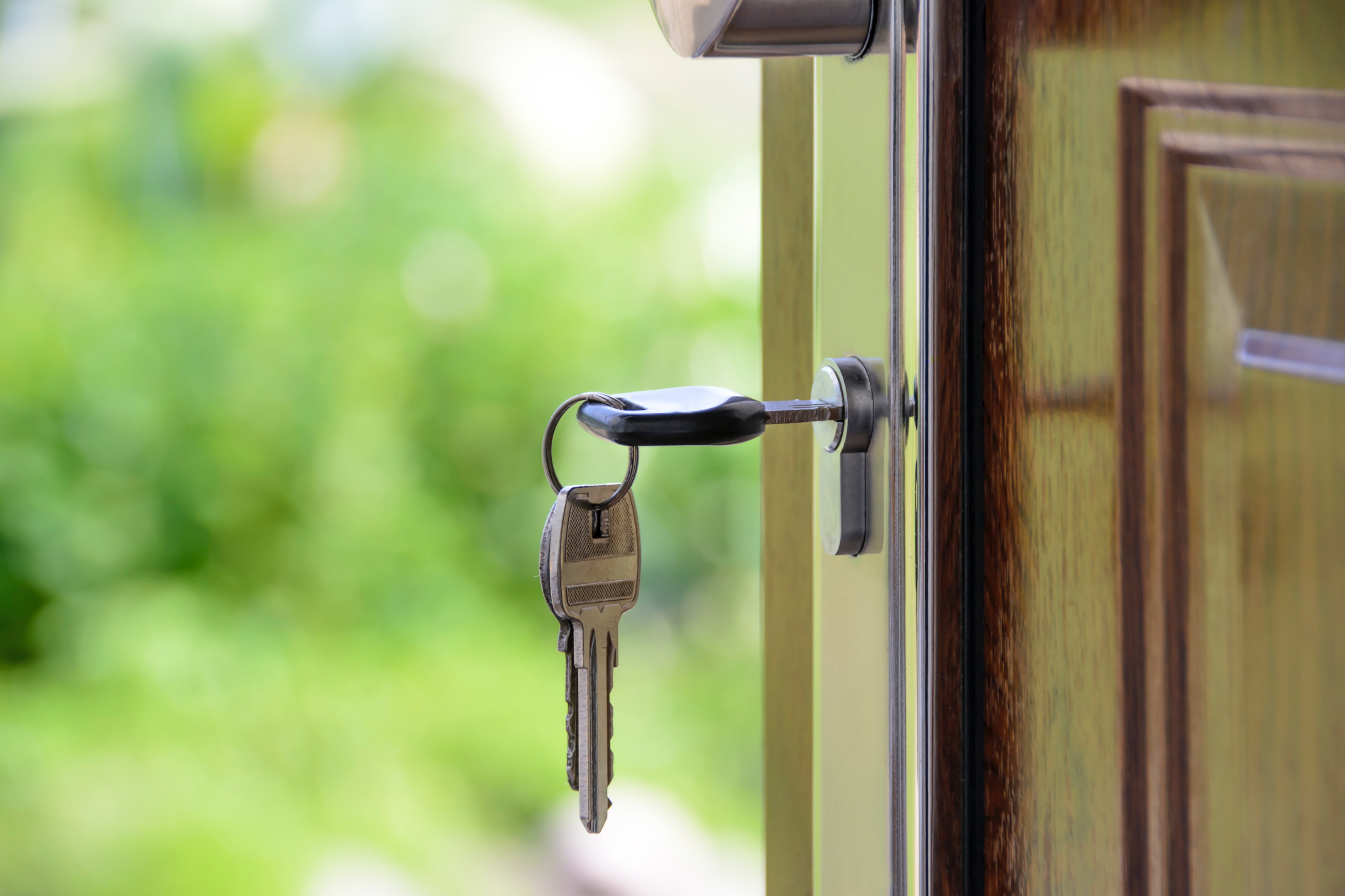 A black-handled key in a key hole