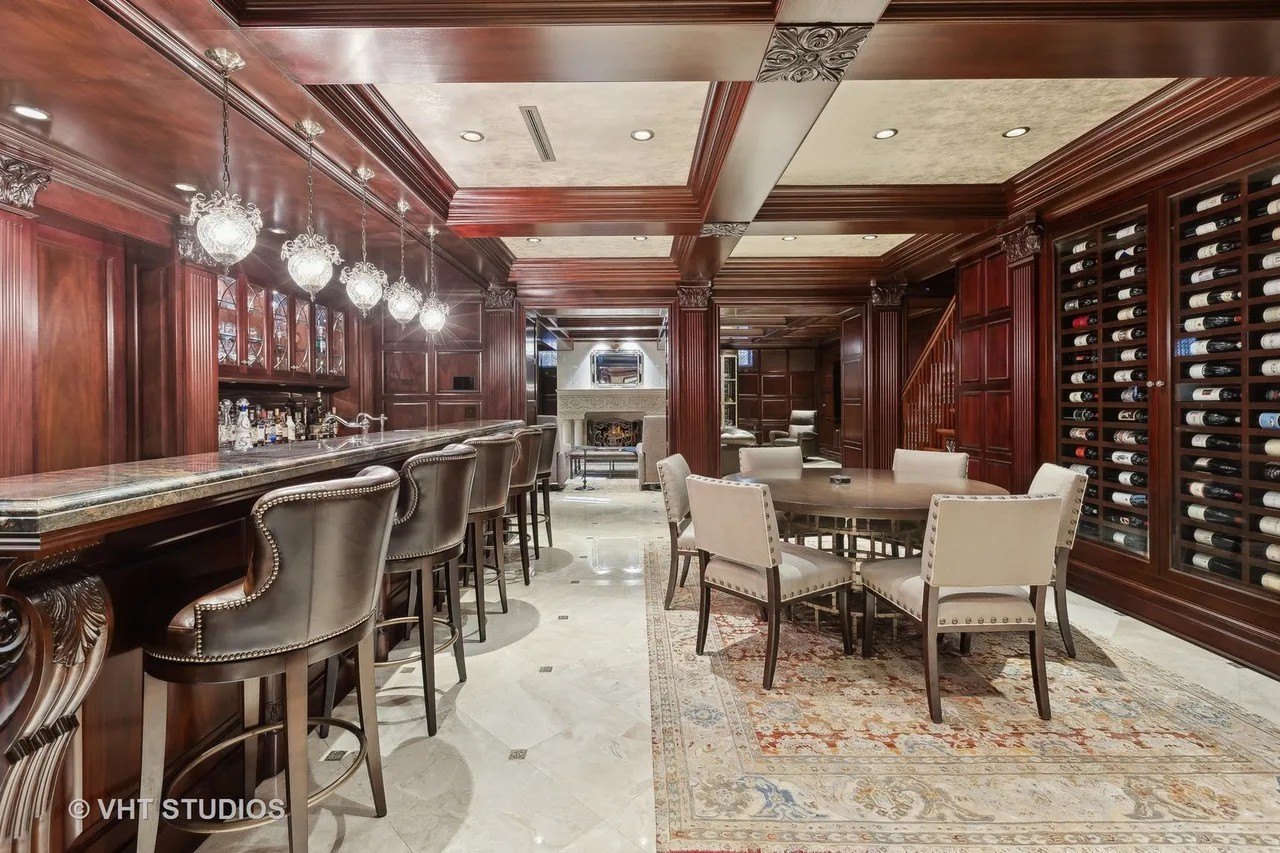 It's the lower level that really dazzles, with its paneled gentleman's pub room with an ornate bar on one side, and an extensive in-wall wine display on the other.