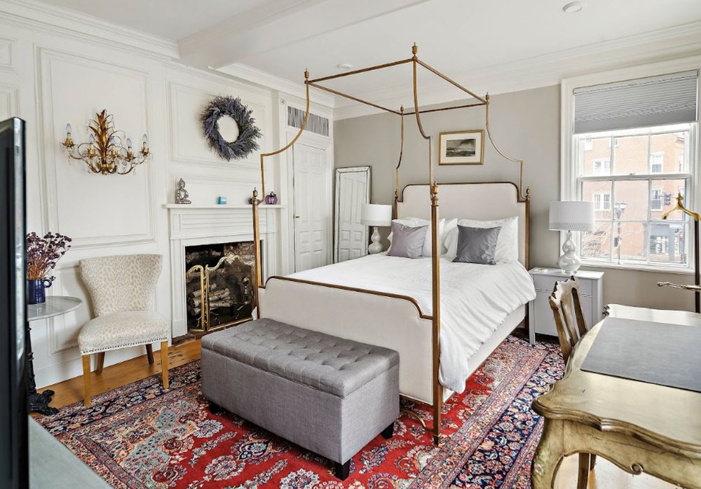 Ensuite bedroom on the second floor with fireplace