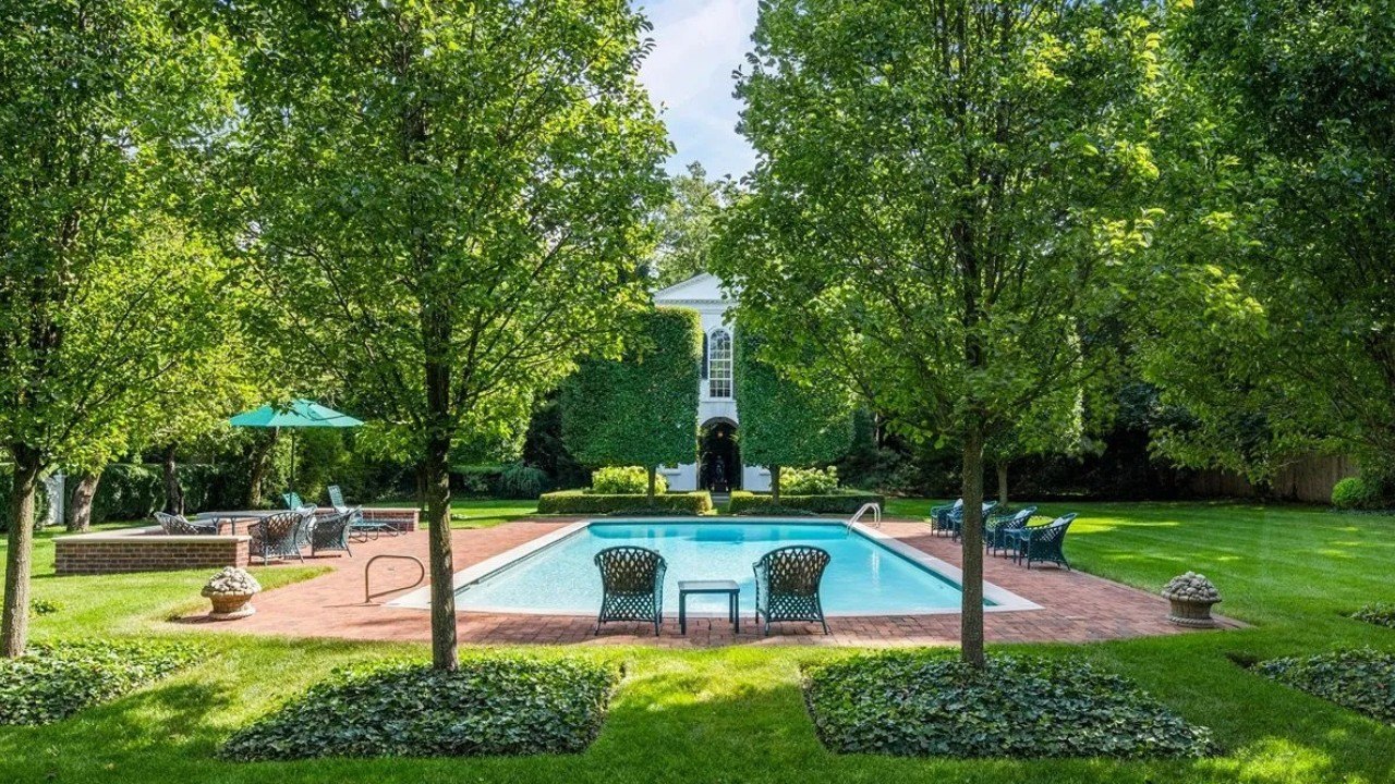 Also found on the expansive lot are an in-ground pool, tennis court, and a one-bedroom coach house that could be used for guest accommodations or extended family.