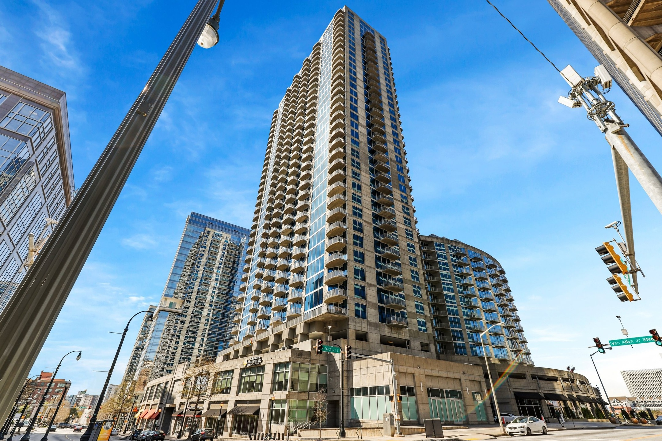 An aerial view of highrise apartment buildings comprised of multiple stories in an urban development 