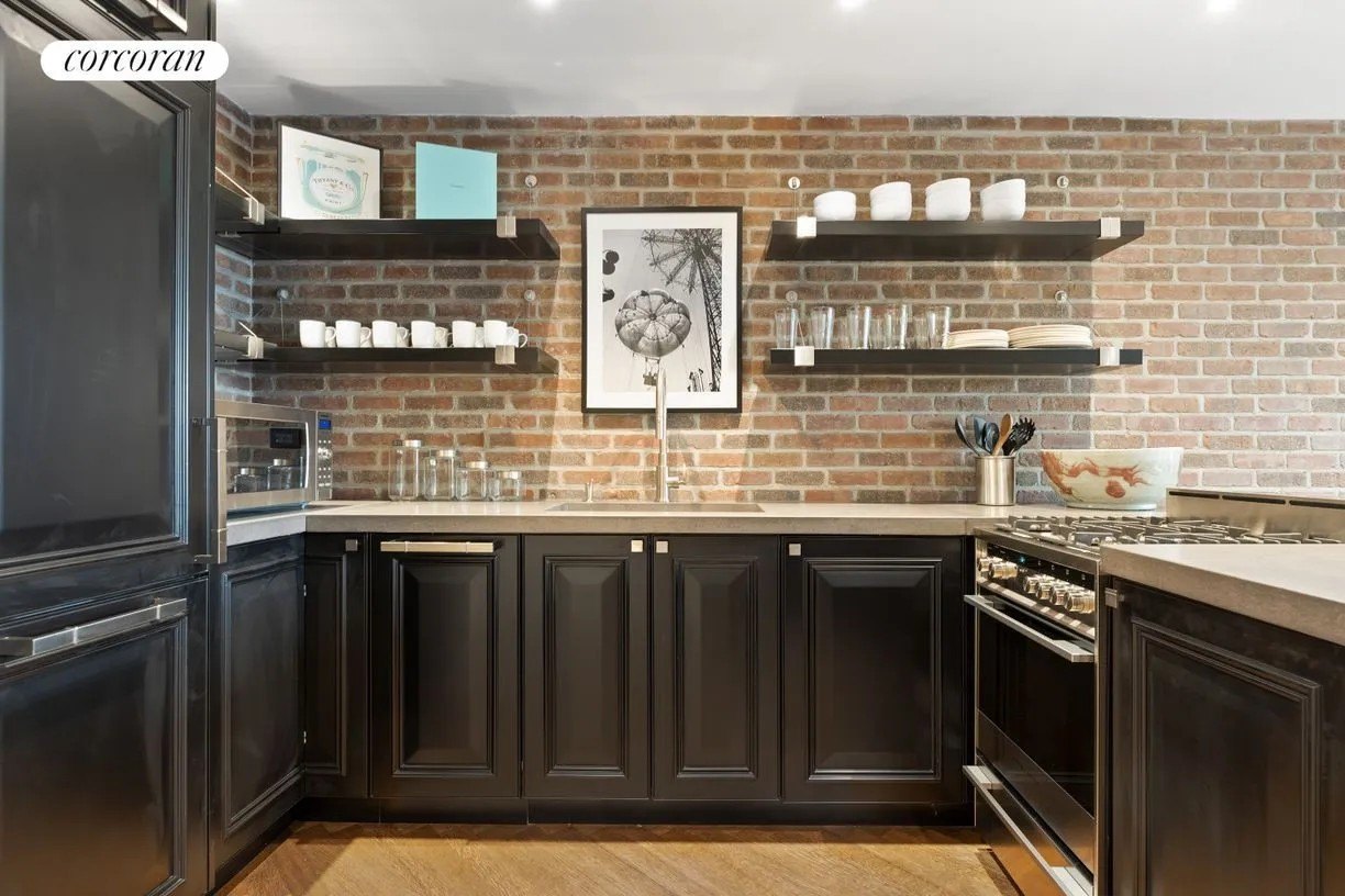 A kitchen in the ‘Breakfast at Tiffany’s’ Townhome after a gut renovation