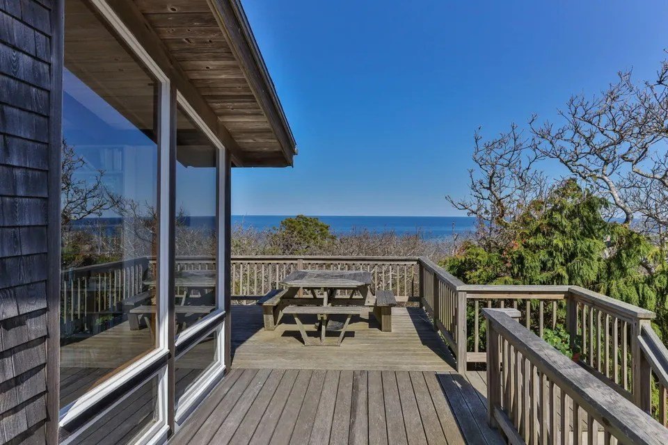 Deck overlooking the Atlantic Ocean at midcentury home in Wellfleet, MA, on sale for $3,350,000