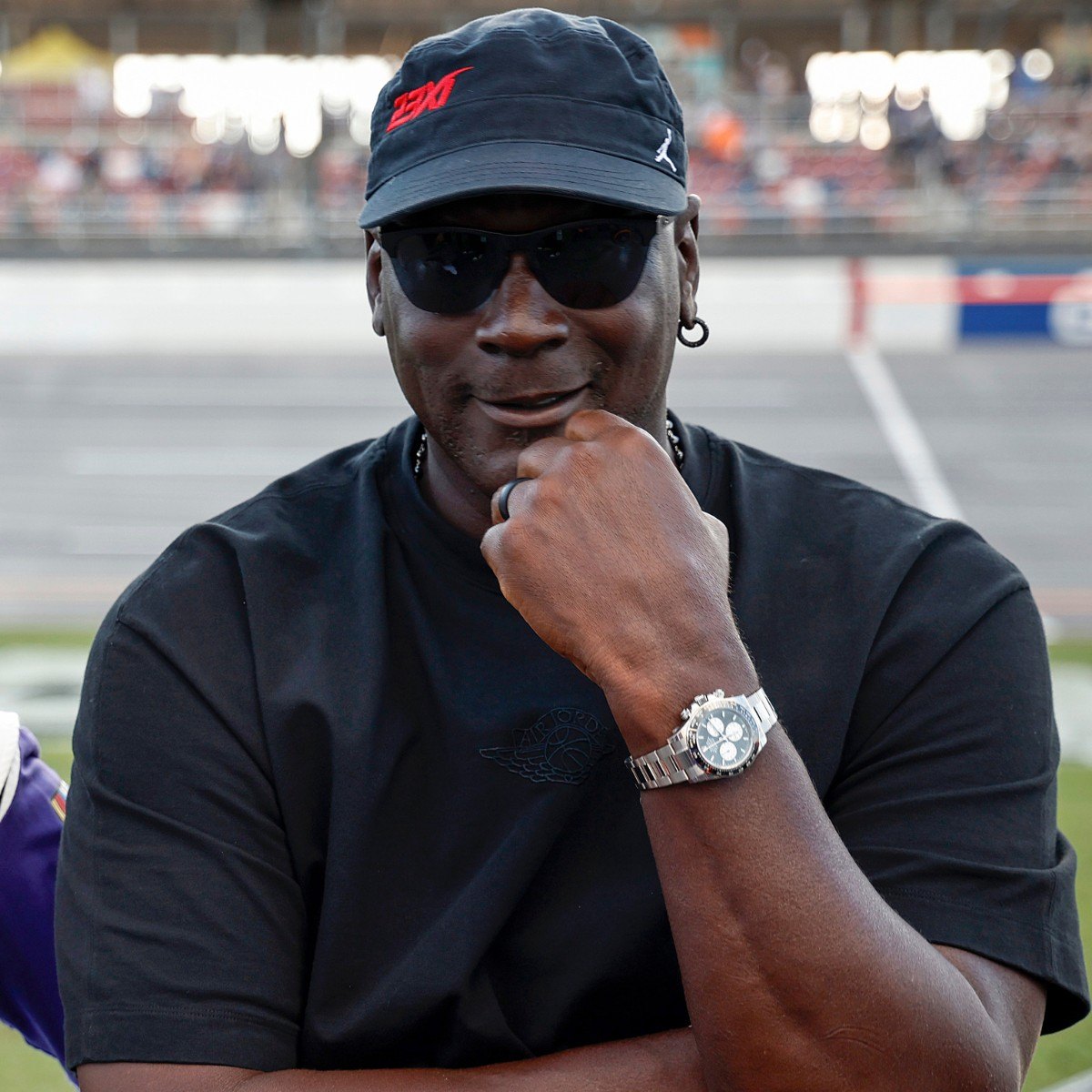 TALLADEGA, ALABAMA - OCTOBER 06: Co-owners of 23XI Racing, Denny Hamlin, driver of the #11 FedEx One Rate Toyota, and NBA Hall of Famer, Michael Jordan talk on the grid after the NASCAR Cup Series YellaWood 500 at Talladega Superspeedway on October 06, 2024 in Talladega, Alabama. (Photo by Chris Graythen/Getty Images)