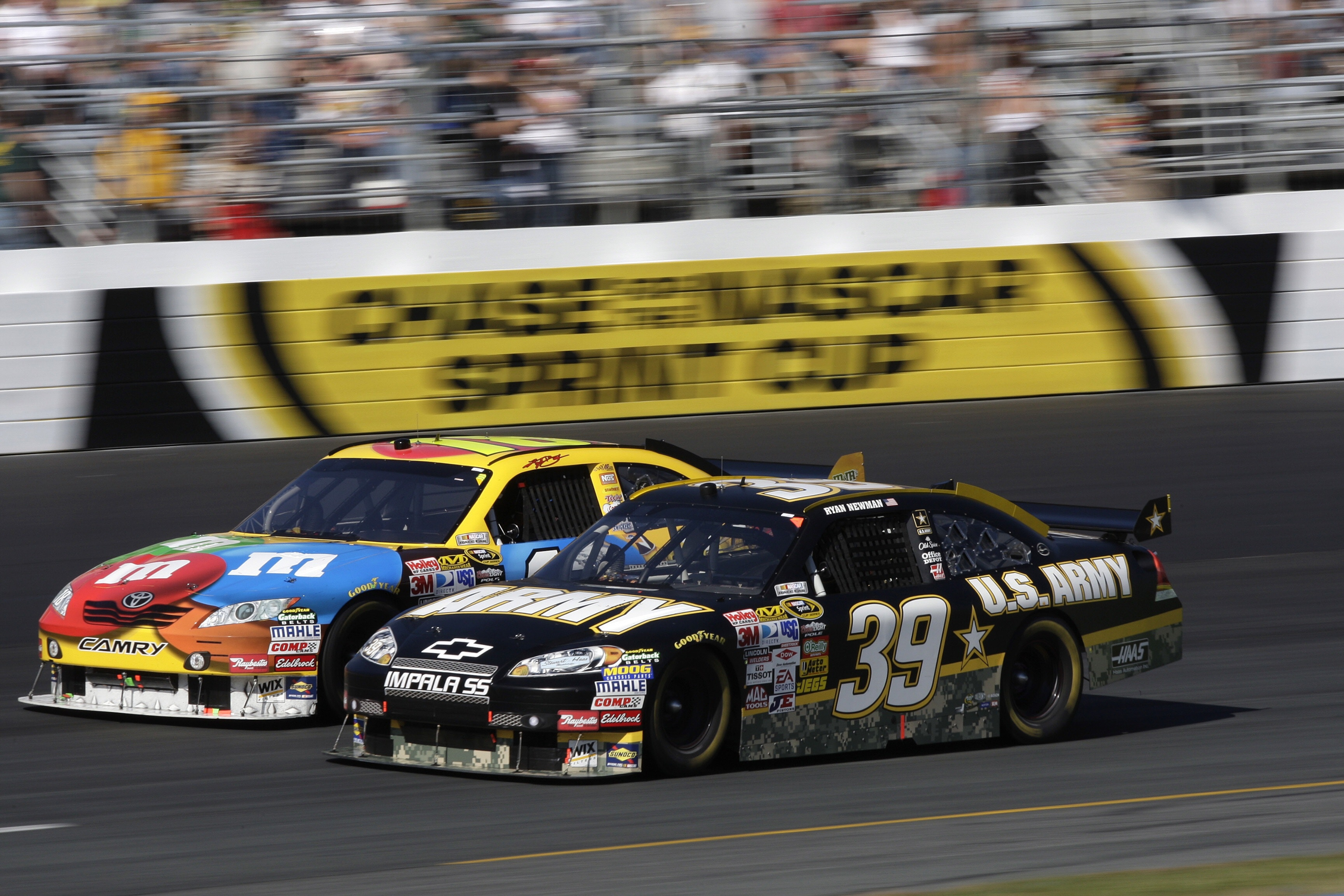 NASCAR cars racing on a track