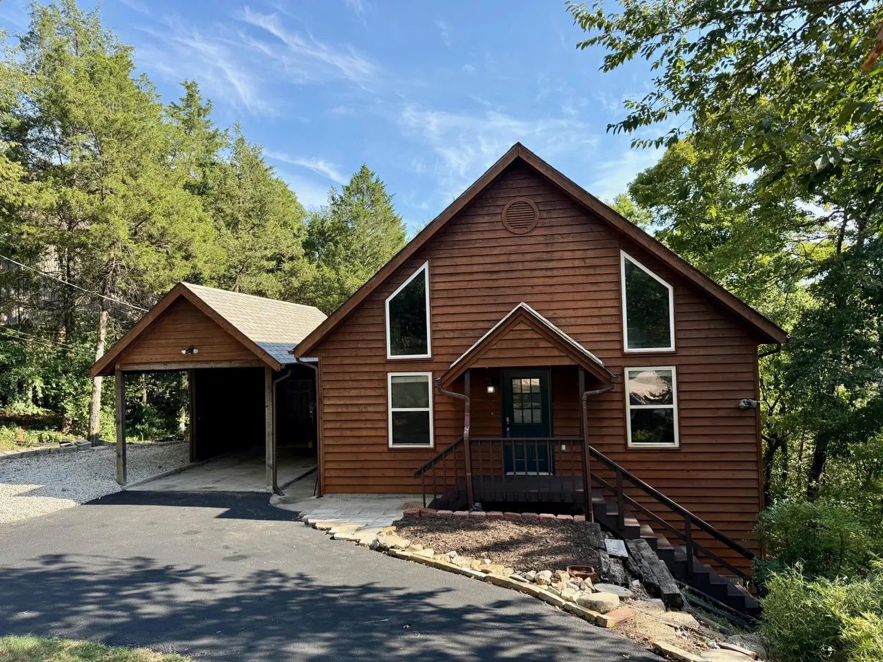 This three-bedroom, three-bath cabin also has a separate studio apartment and steps from the lake. It's listed for $299,000.