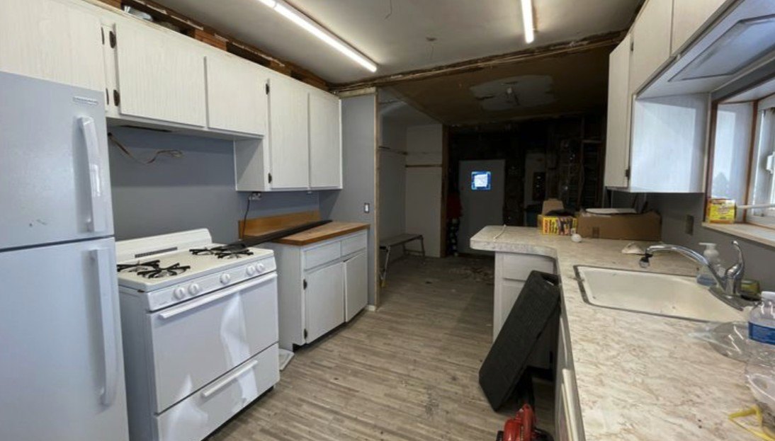 The kitchen was a hodgepodge of styles, from different eras, none of them very attractive.