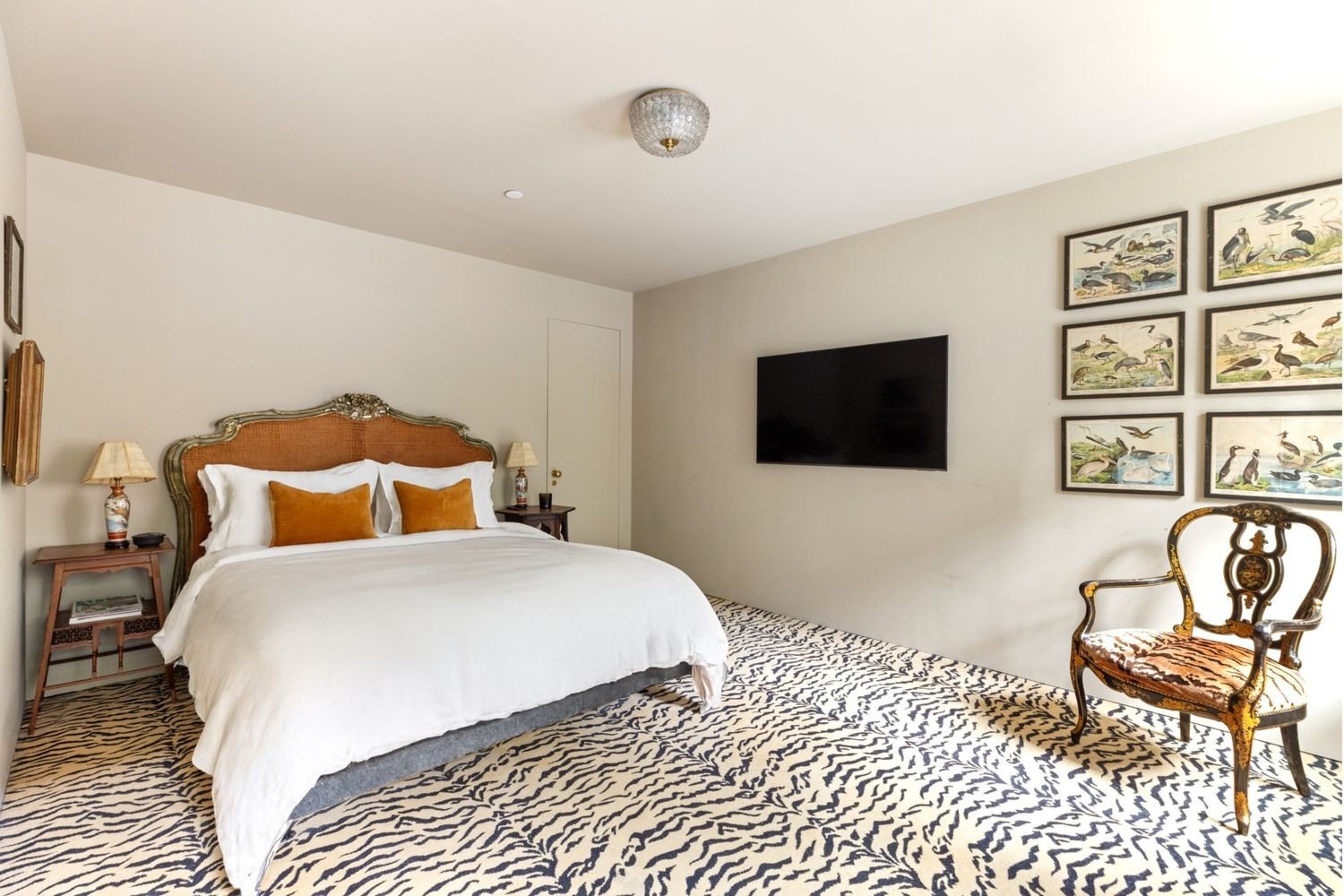 Bedroom with a tiger pattterned rug in Lily Allen and David Harbour's home in Brooklyn