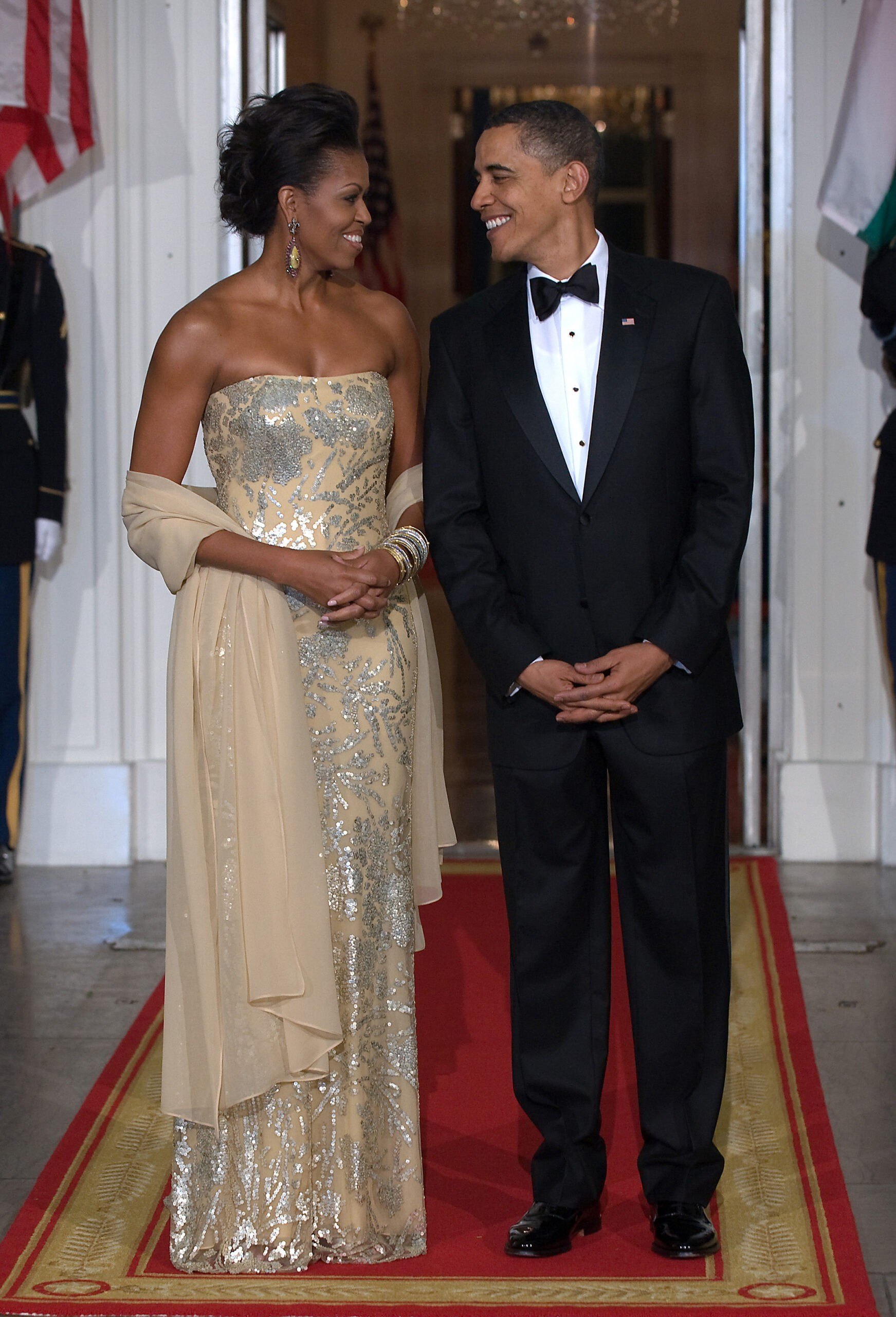 US President Barack Obama stands with First Lady Michelle Obama