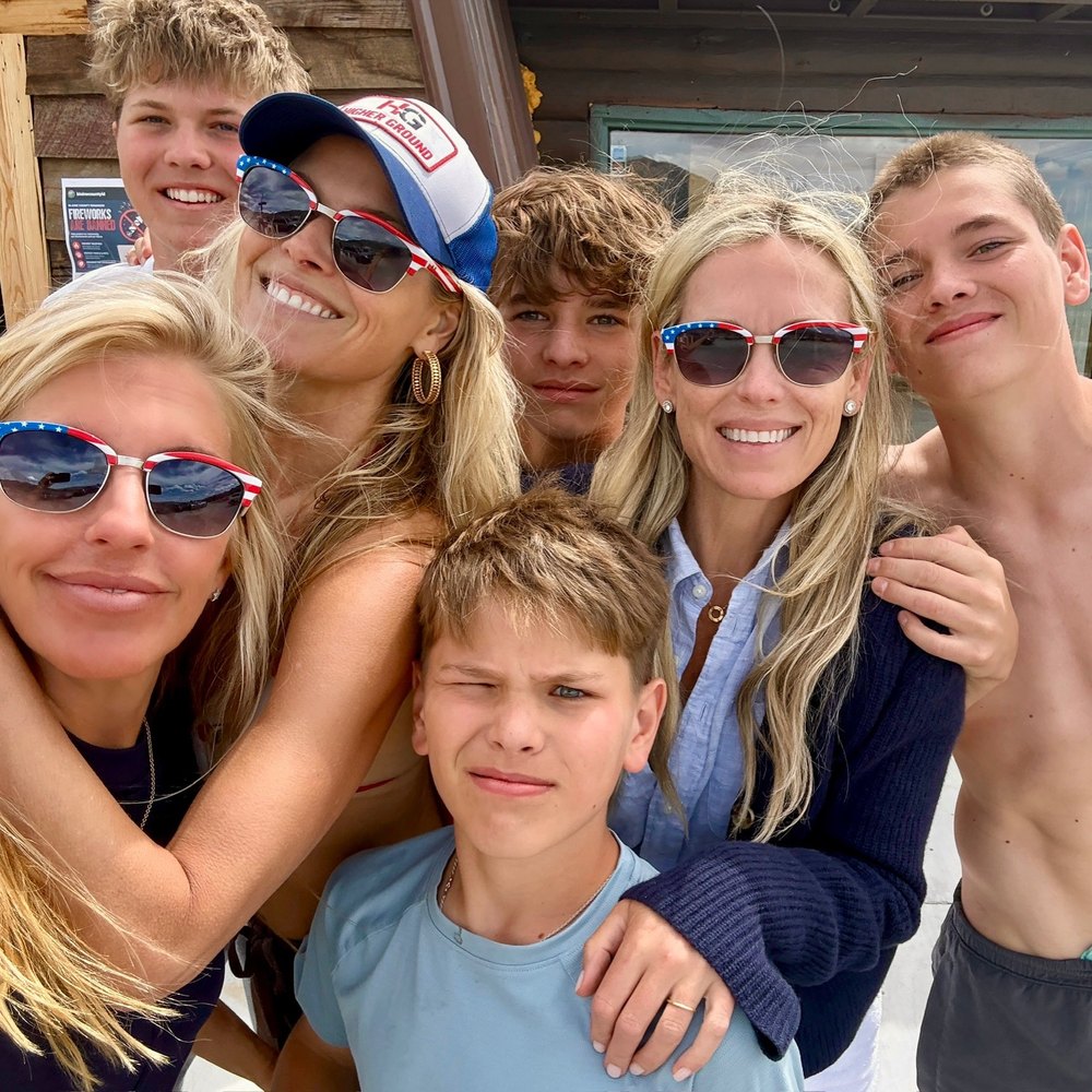 Close-Up Portrait of a Happy Family Wearing Patriotic Sunglasses