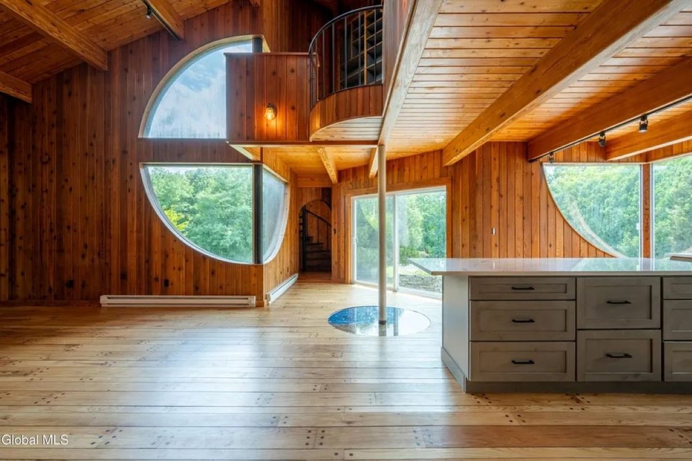 Two-story interior of midcentury home in Hague, NY, on sale for $995,000