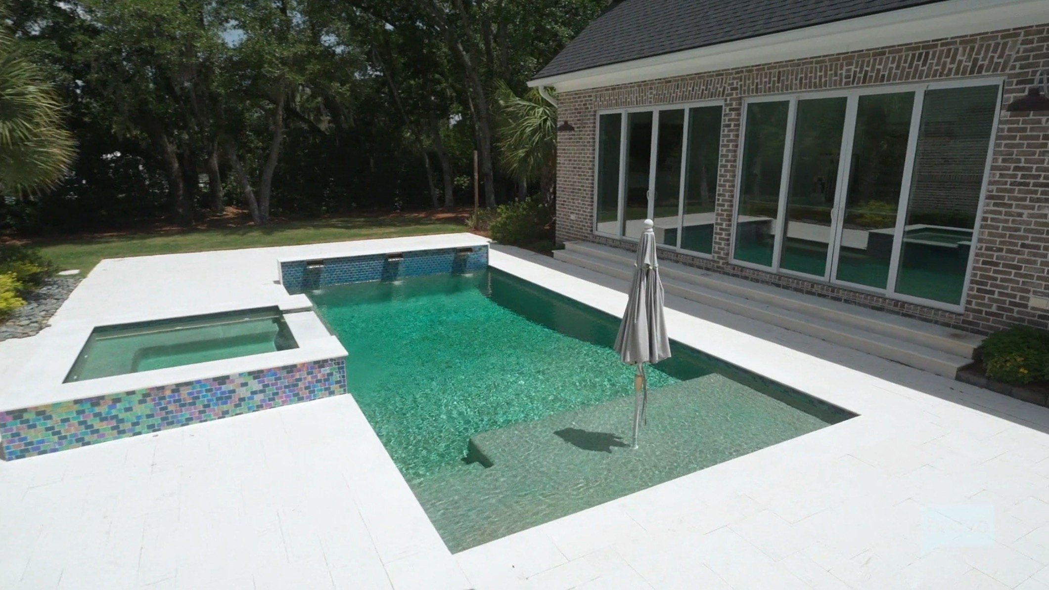 The original pool gave LeCroy "90s pool tile" vibes, so she ripped it out and gave it a "whole new facelift."