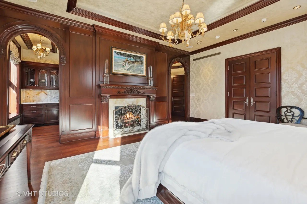 The primary suite is also located on the second floor, and is highlighted by a fireplace, wet bar and a luxurious bath.