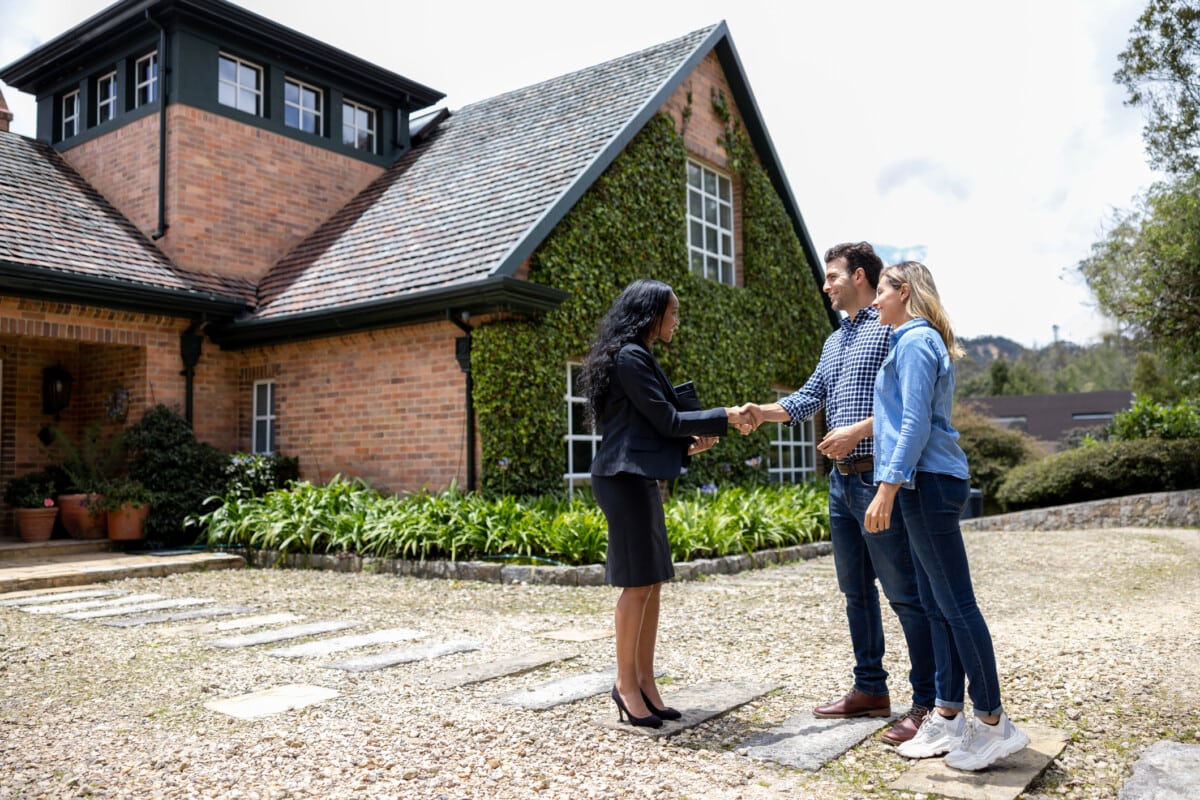 Real estate agent meeting a couple for a house showing in Arizona 