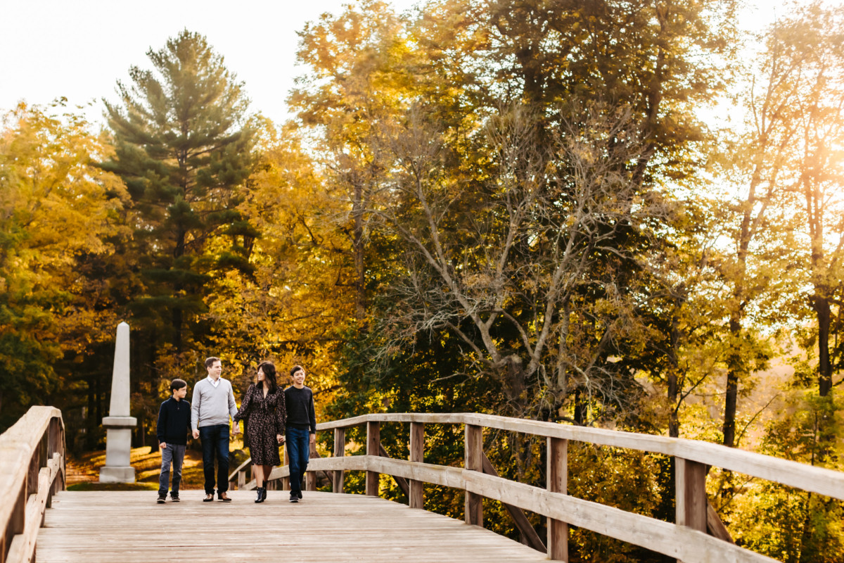 Couple walking over Concord Bridge