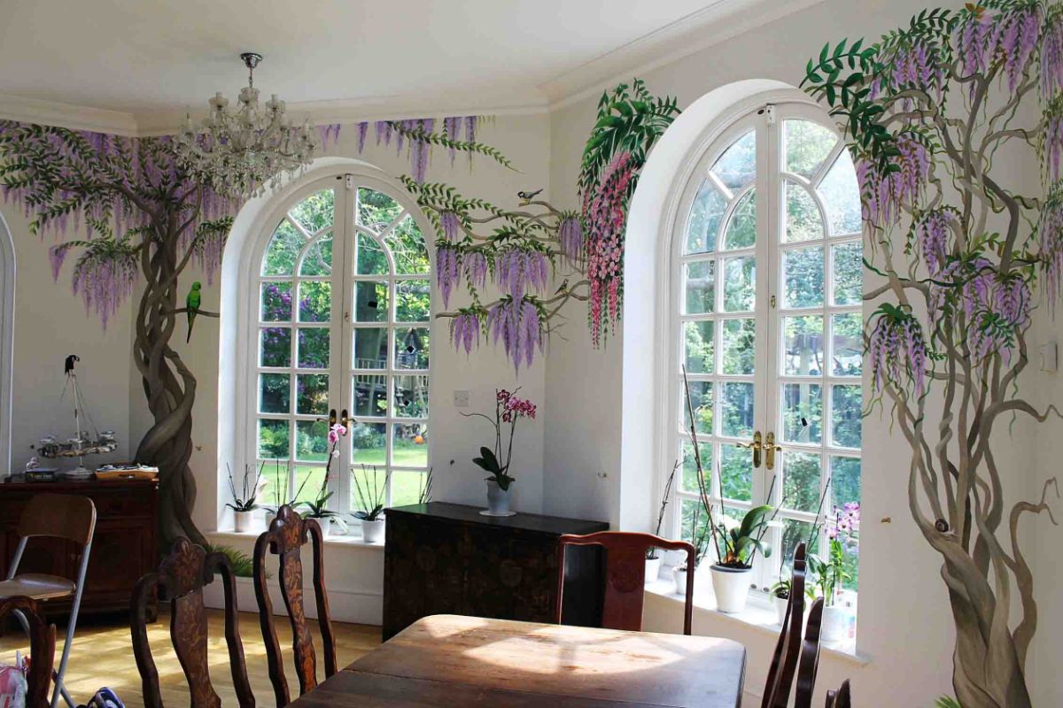 A living room with a floral mural